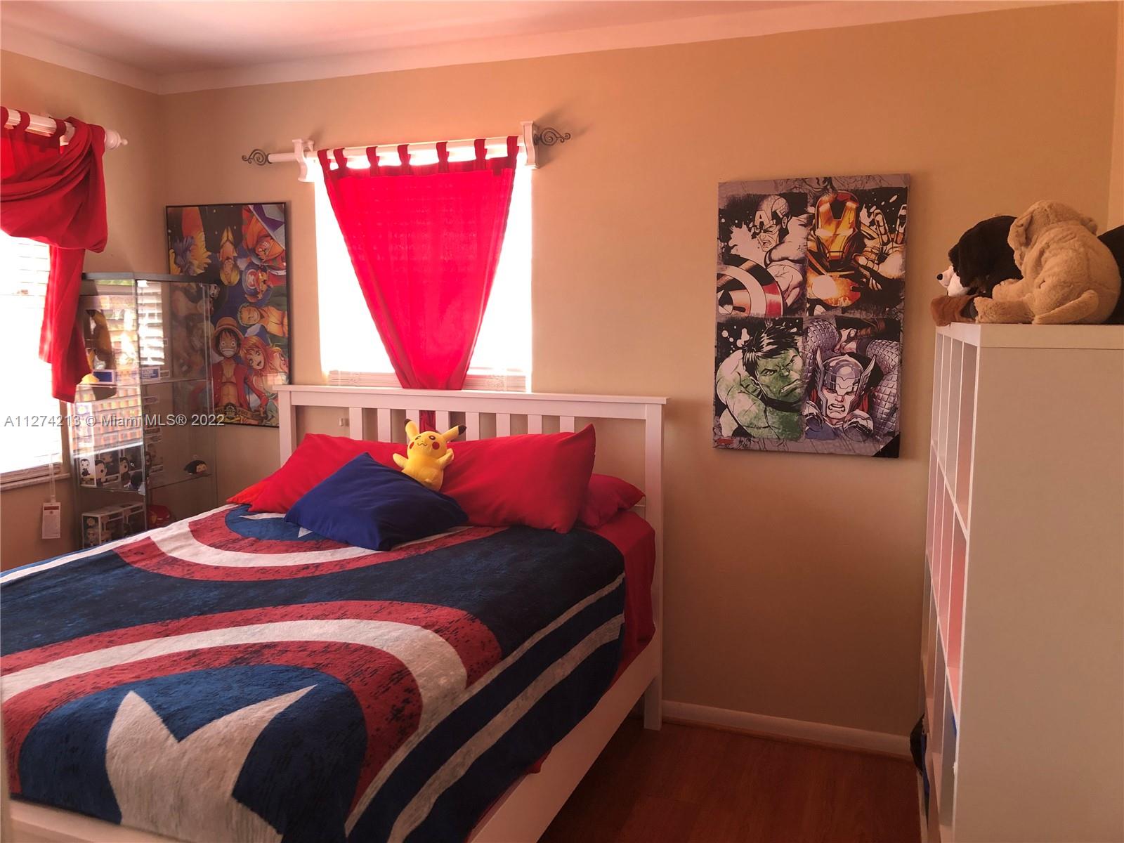 Bedroom. Bedroom #2 on 2nd Floor with ceiling fan, closet, and crown molding throughout.