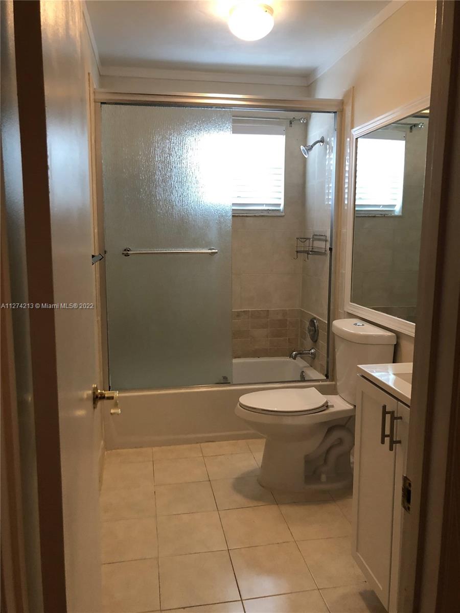 2nd Bathroom - Second Floor. Completely remodeled, tile floors, vanity, bathtub and impact windows. Located between Bedroom #2 and Bedroom #3