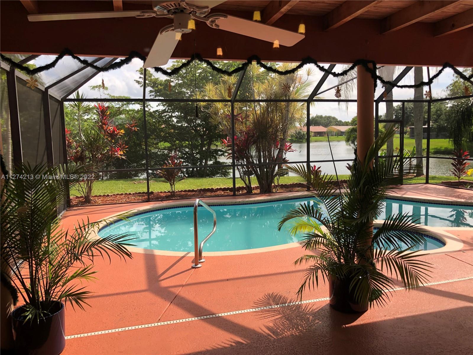 The pool and spa. Lanai enclosure for pool and covered entertainment area