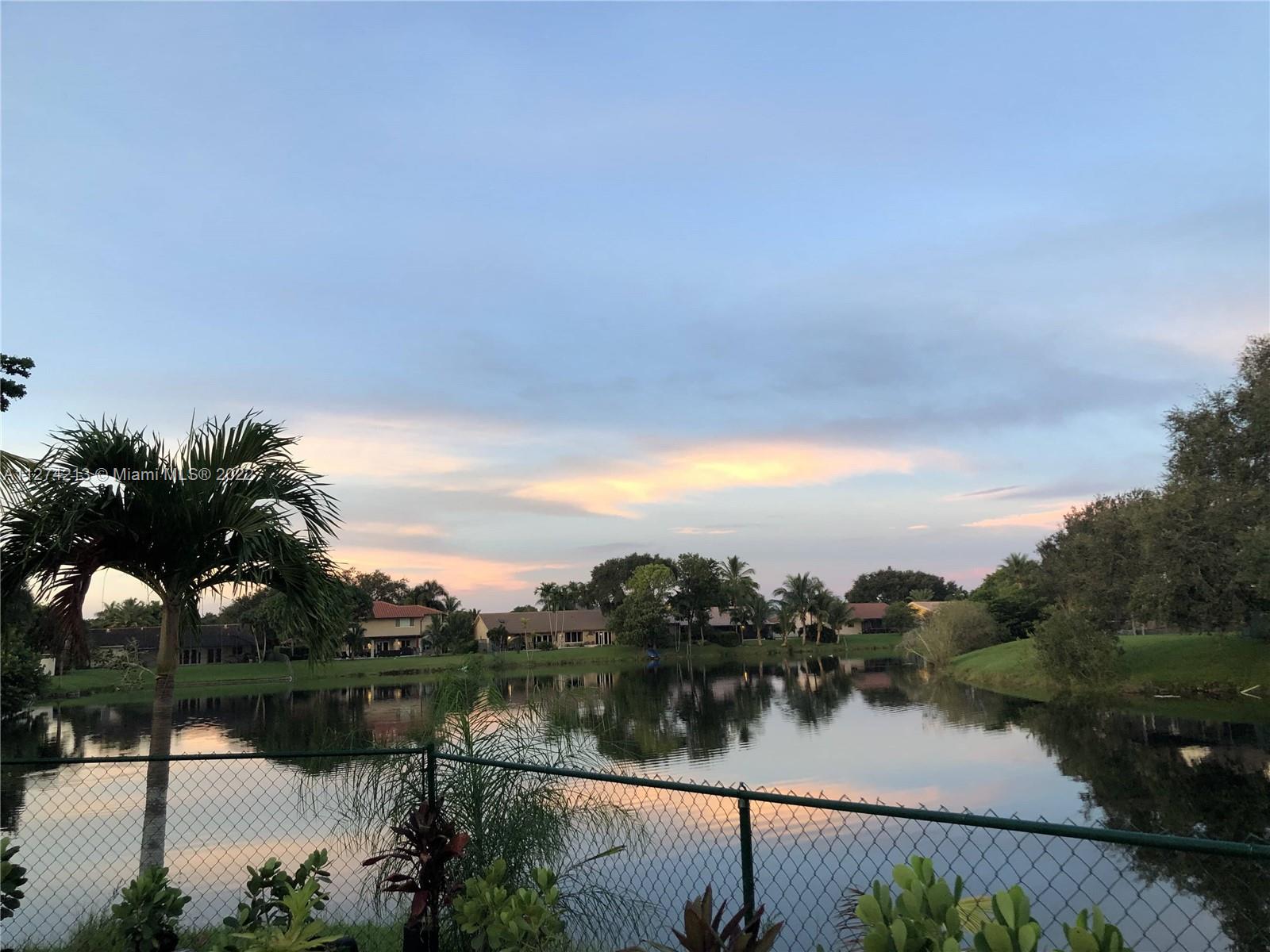 Fully fenced oversized yard overlooking lake.