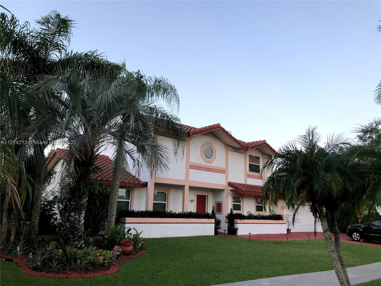 Front of House. Impact windows throughout. Beautiful two story home with, two car garage, impact windows installed 2021 and roof installed 2018.