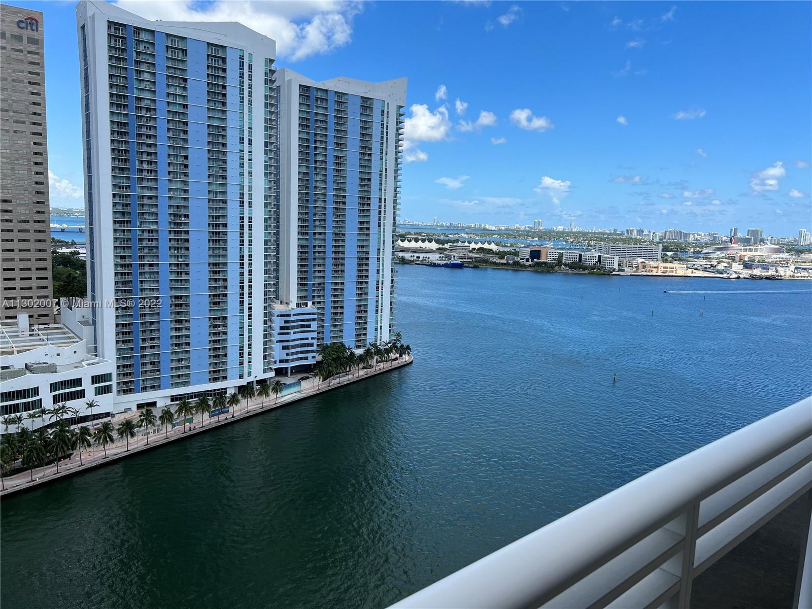 Water and skyline views, luxurious residence, marble floors, huge balcony, eat-in kitchen with Italian cherrywood cabinetry, stainless steel appliances, wine cooler, master bath with bidet, whirlpool and separate shower, walk in closets, full washer and dryer, amenities include bi-level fitness center, infinity 30 meter pool, tennis, racquetball, concierge, security. Brickell Key is and exclusive island oasis with $500 million invested in this centrally located island close to airport and beaches.