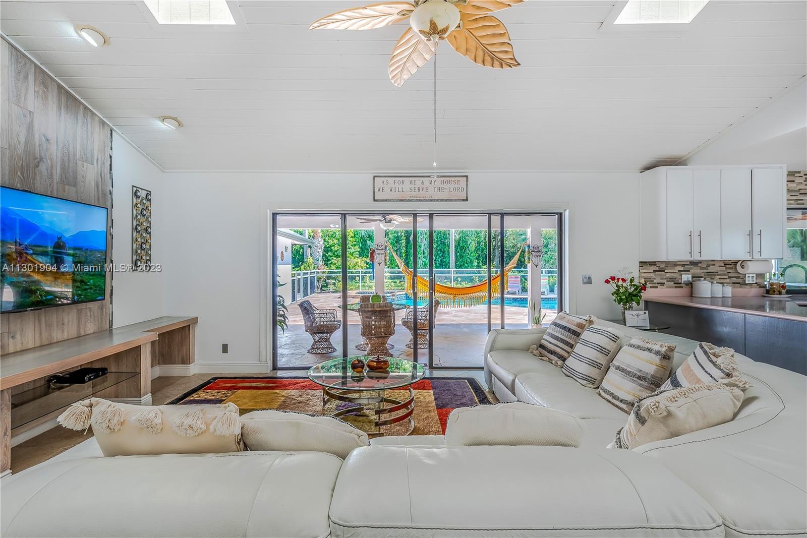 Garden View Formal Dining Area with designer table and basking in natural light