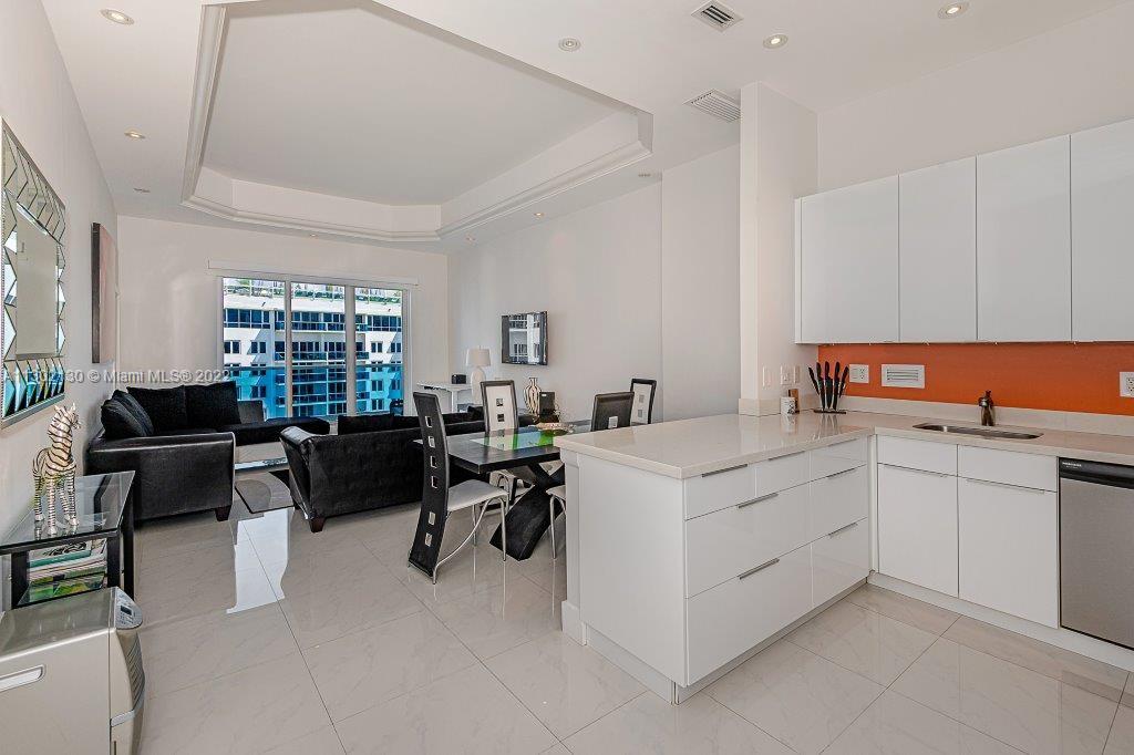 Discover luxurious living in this oceanfront junior 2-bed, 2-bath condo with high ocean views and 14-foot ceilings in a sought-after South Beach building. Fully furnished and boasting an in-unit washer/dryer, this condo is a fantastic investment with monthly rentals allowed. Maintenance covers essential amenities, including valet parking.

The building is undergoing an upscale renovation, enhancing common spaces with a modern beach house feel. As a Roney Palace resident, indulge in 1 Hotel's amenities: oceanfront pools, hot tub, beach service, and on-site dining options. Stay fit at SoulCycle, Anatomy Gym, and pamper yourself at the high-end spa, salon, and fashion boutiques. Embrace the ultimate South Beach lifestyle today!