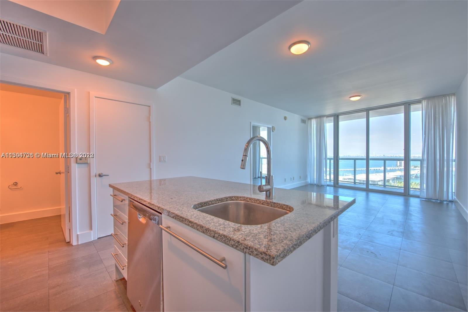 Beautiful 1 Bed/1.5 Bath condo at Marina Blue w/ 845 interior square feet, beautiful with a wooden floor (Brasilian Teak) flooring throughout, walk-in closet w/ built-in cabinets, stainless steel appliances, washer/dryer, spacious balcony, and 9-foot high ceilings with floor-to-ceiling glass windows offering breathtaking views of Biscayne Bay, Museum Park, Miami Beach skyline, and cruise ships. Rent price includes basic cable TV, water, and 1 assigned parking space. Building amenities: two swimming pools (sunset & sunrise), hot tub, fitness center, sand volleyball court, 24-hour concierge, valet parking, business center, and party room.