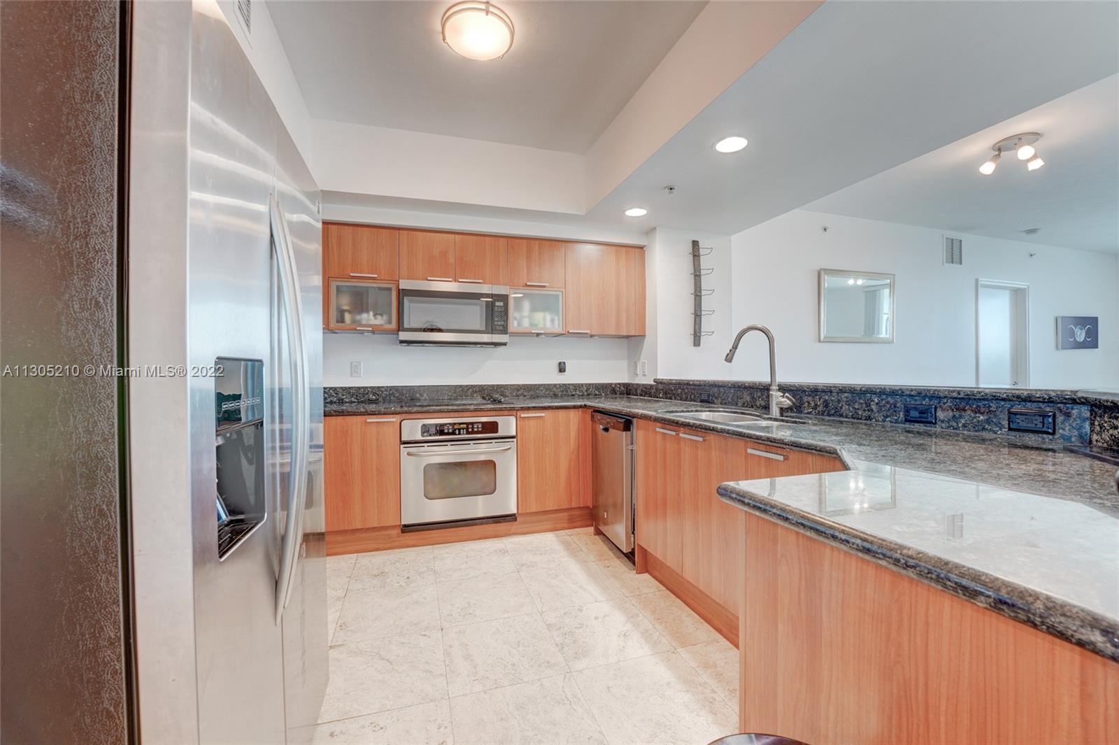 Beautiful wood cabinets and stainless steel appliances