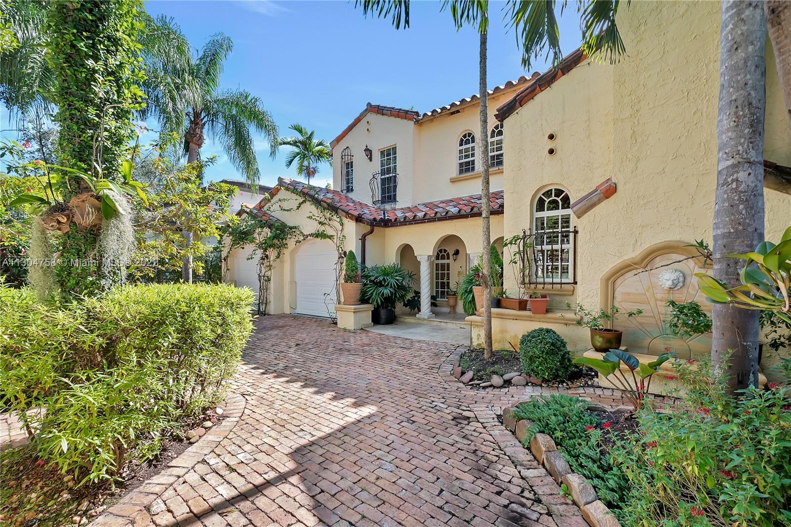 Stunning, classic Spanish style home built in 1923, renovated & move-in ready. 5 bdrm/ 3.5 bath home, on a 11,250 sq ft lot, on the quintessential Asturia Av in Coral Gables. Beautiful architectural details. Many entertaining areas incl. formal living w/ fireplace, formal dining, sunroom & charming interior courtyard. Fantastic chef’s kitchen w/ center island, granite counters, wood cabinetry, gas stove. Spacious family rm. 3 bdrms up incl. grand primary suite w/ fireplace, marble bath, terrace w/ seating. 1 ensuite bdrm down, perfect for guests. Relax under the shade on one of many covered patios surrounding the pool & heated jacuzzi. Lush landscaping. Gated, brick paver circular driveway. 2 car garage. Full home generator. Impact windows/doors. Only 1 block from Granada Golf Course.