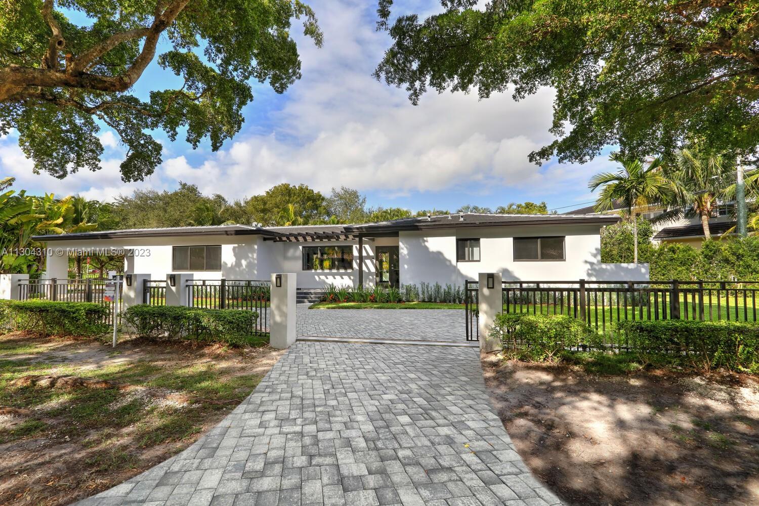 New South Coral Gables turnkey move-in-ready home lives large. This spacious turnkey home has 4 bedrooms, 5 bathrooms, pool, & 2-car carport on a perfectly located gated corner double lot. A rare find, each bedroom has ensuite bathrooms & generous closets. New plumbing, electrical, mechanical, roof, impact windows, cabinetry & flooring. Property has 3 electric gates with access from San Remo Ave and Domenico Ave. Open floor plan with beautiful custom kitchen, Bosch appliances & large walk-in pantry. Other features: spacious laundry, mudroom, 32x32 porcelain flooring, LED recessed lighting throughout. Located within top rated Sunset Elementary school district & walking distance or fun golf cart ride to restaurants, shopping, groceries, park & top rated schools Coral Gables has to offer.