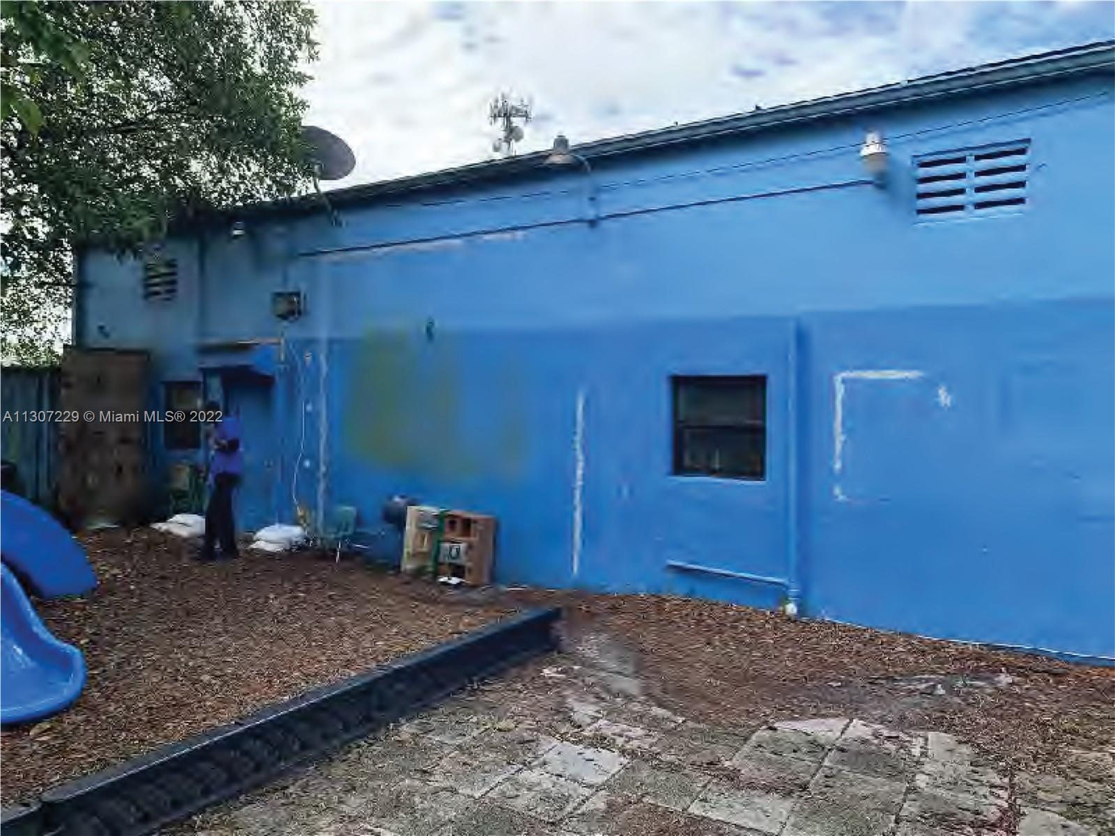 Children's Play Area / Back Yard of 3,000 SF Main Building