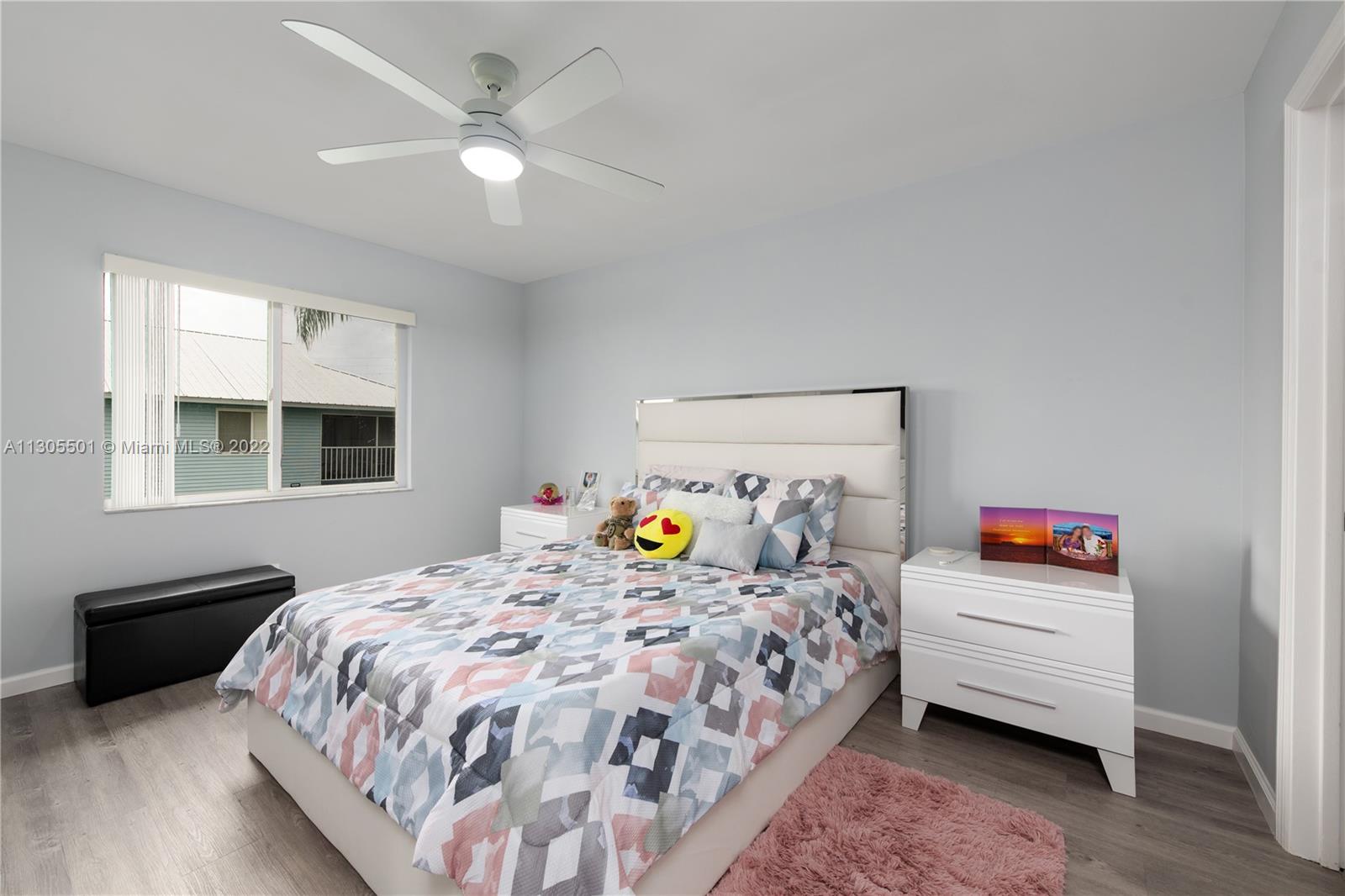 View of the primary bedroom as seen from the doorway to the primary bedroom.