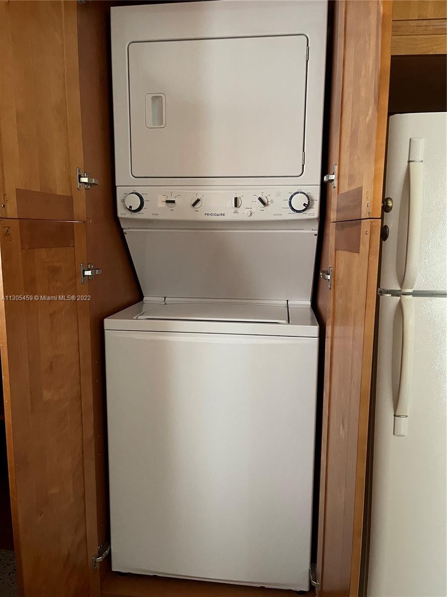 View of built in washer and dryer front unit