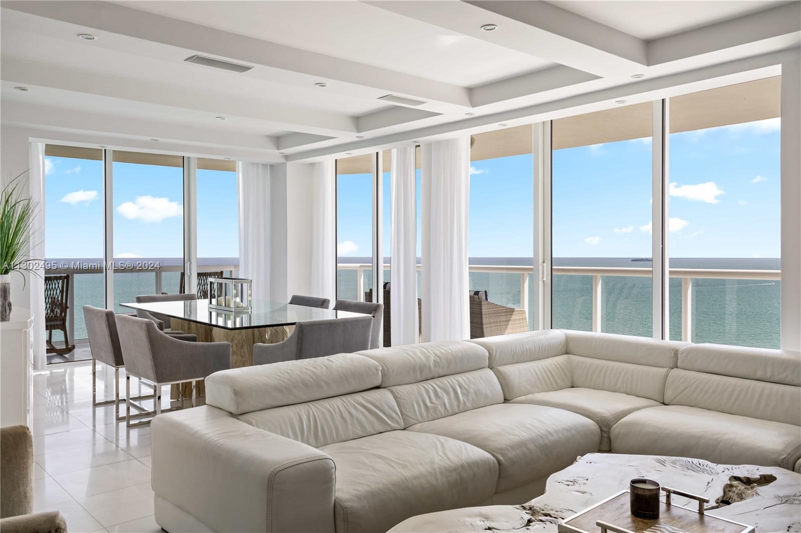 CONDO IN THE CLOUDS" located in the highly sought after AKOYA Luxury Condo in Miami Beach 38 floors high into the clouds. Ocean front WRAP AROUND BALCONY with PANORAMIC views overlooking beautiful MIAMI BEACH crystal blue waters. Fully furnished by AWARD WINNING designs of ARTEFACTO. Over 1700 sqft of pure luxury, THASSO marble floors. Every room has absolutely spectacular oceanfront views. Originally a 3 bed 2.5 bath converted into 2 full master bedrooms with 2 full bathrooms and a half bath, 2 parking spaces conveniently located next to building entry door. Fingerprint building access. Amenities include, sauna, racquetball, tennis, golf, 24hr concierge, pool, direct beach access, BBQ and much more. This is a luxurious dream vacation home in the clouds. *RATES MAY VARY* Seasonal Rental.