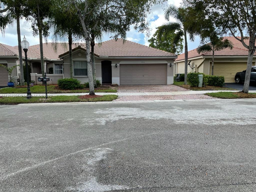 Beautiful home with granite kitchen counters and water view. New barrel tile roof in 2021. Vaulted ceilings, accordion hurricane shutters, paver driver, screened porch and fenced rear yard. Tile and hardwood floors, no carpet. Transferrable home appliance contract.