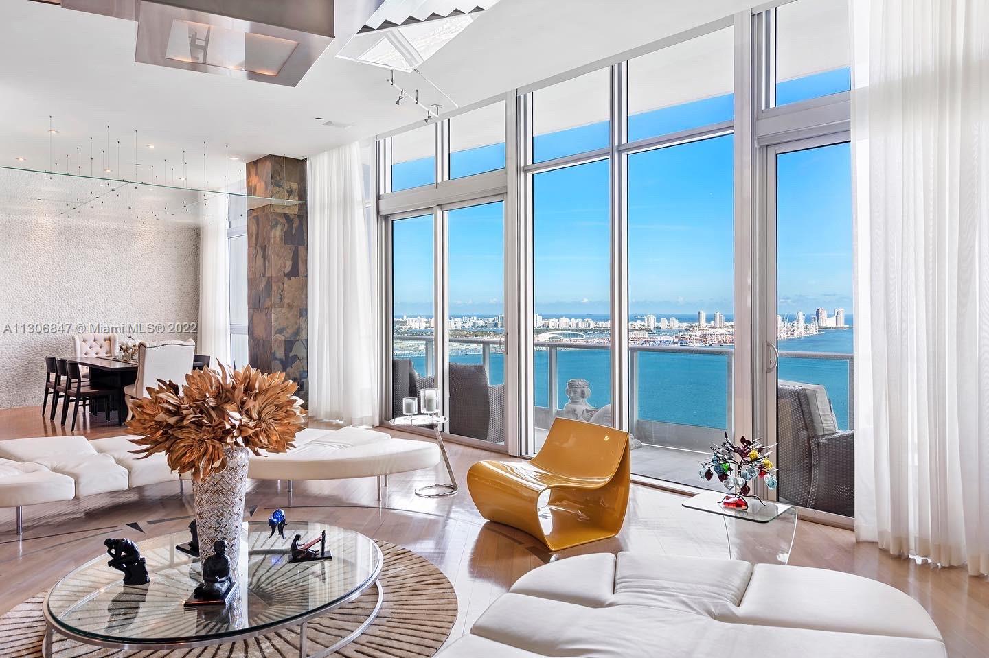 Impressive 4 bedrooms bayfront residence fully furnished in one of the most private & renowned buildings in the city Jade Brickell. 14ft tall ceilings, top of the line appliances, flow-thru floorplan which includes a media room, a bar, formal dining room, 2 terraces (ocean and city views), office & extensive master bedroom walk-in closet.  Wooden floors throughout the unit, iconic decoration with stylish highend finishes.