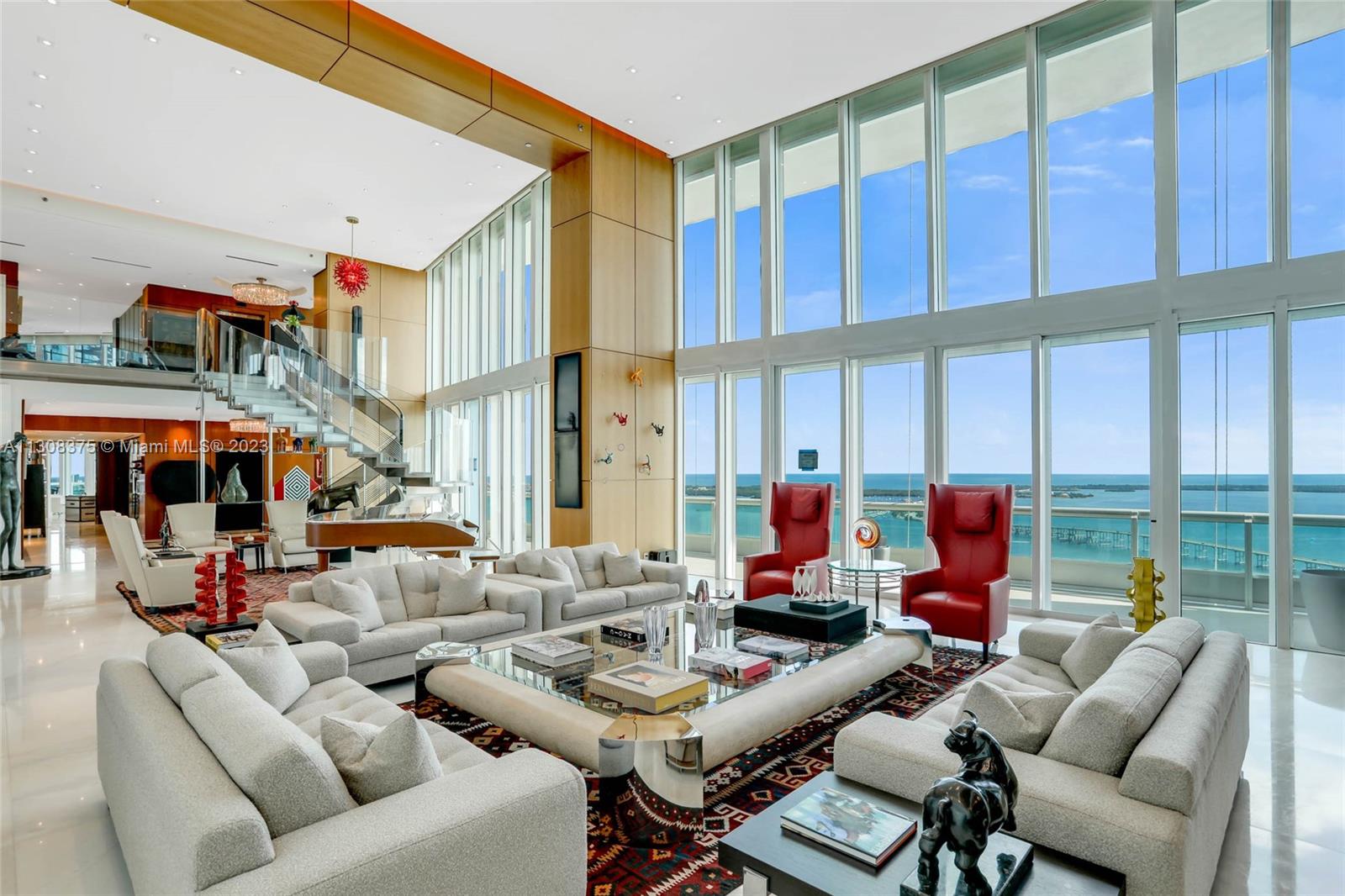 This is an absolutely gorgeous and stunning duplex  in the sky with 180 degree views of Biscayne Bay, Miami Beach, Fisher Island, Key Biscayne and beyond and city scape views from the west side.  Completely updated in the most exquisite taste and sophistication. All new marble floors. This is a home for the most cultured and elegant buyer. No expense was spared. Enjoy your own private pool (under renovation), 4 assigned parking spaces (2063,2086,2087,2088) and storage #B-060. Marina slip #13 with dimensions 27' x 97' x 5'25''This is a first class building offering privacy, full services and an outstanding way of life! To see it is to want it!
