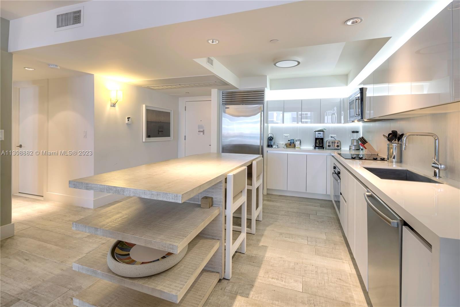 Experience unparalleled luxury living in this exceptional 1 bedroom, 1 bathroom residence situated in the prestigious 1 Hotel & Homes South Beach. Impeccably furnished with the exclusive 1 Hotel furniture package, this unique dwelling is currently enlisted in short-term rentals through Five Star Luxury Travel, generating impressive annual revenue. The building boasts a comprehensive range of amenities, including a fully staffed residence lobby, valet attendants, personal concierge services, chauffeured sedans, 4 sparkling pools, 4 delectable restaurants, 3 chic bars, an expansive 14,000 square-foot fitness center, a pampering Bamford Spa, a professional hair salon, invigorating Soul Cycle classes, and so much more. The adjacent one-bedroom unit can be purchased and combined.