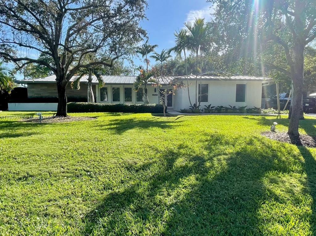 Half acre lot in North Palmetto Bay (great schools & parks). 5 bed, 3 bath, 2 car garage, boat/RV storage on 65ft driveway on side with gate access,  bathroom pool access. High-grade impact doors & windows. PVC sewage & drain lines throughout the house. Metal roof installed in 2009 (50 yr minimum life). Trane & Mitsubishi 7.5 ton AC installed in 2017. Garage also air conditioned, Inground hardwired & remotely controlled Landscape lighting additional electrical outlets (4 front, 4 back - remotely controlled as well). Gas cooktop, U-Line Undercounter fridge, Wall mounted electric water heater -New impact resistant garage door, New Flat roof (siliconized with GacoRoof 50 yr warranty) Automatic exterior shades (Florida room), High elevation lot - no mandatory flood insurance required