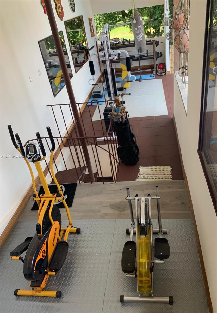 Gym overlooking garden and golf course