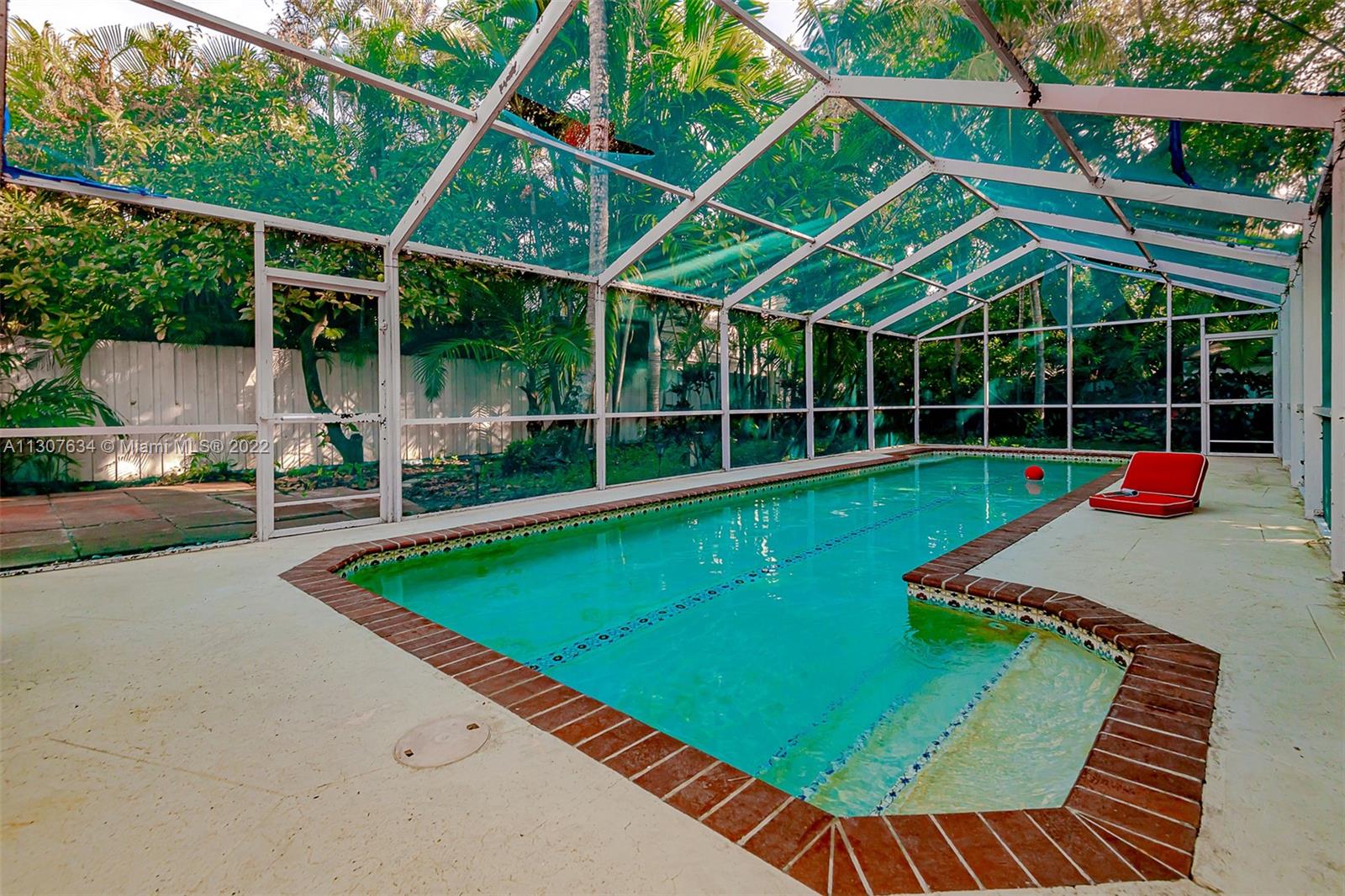 A tropical oasis in the heart of Silver Bluff with a large enticing swimming pool. This charming 1936 Bungalow is surrounded by a mix of palm trees and exotic vegetation offering utmost privacy on an oversized lot. Ideal for an investor, a renovator, or someone wishing to expand. An open floor plan with original hardwood floors, distinctive Pecky Cypress ceilings, and abundant natural daylight. Easy walk to Metrorail stations and Coral Way businesses with quick access to US1 and I95. Enjoy the cultural, shopping, and dining districts in nearby Coconut Grove. A short distance to downtown Miami, the Arsht Center for the Performing Arts, Biscayne Bay waterfront, University of Miami, Coral Gables, and the MIA International Airport. Great public transportation abounds with nearby bike lanes.