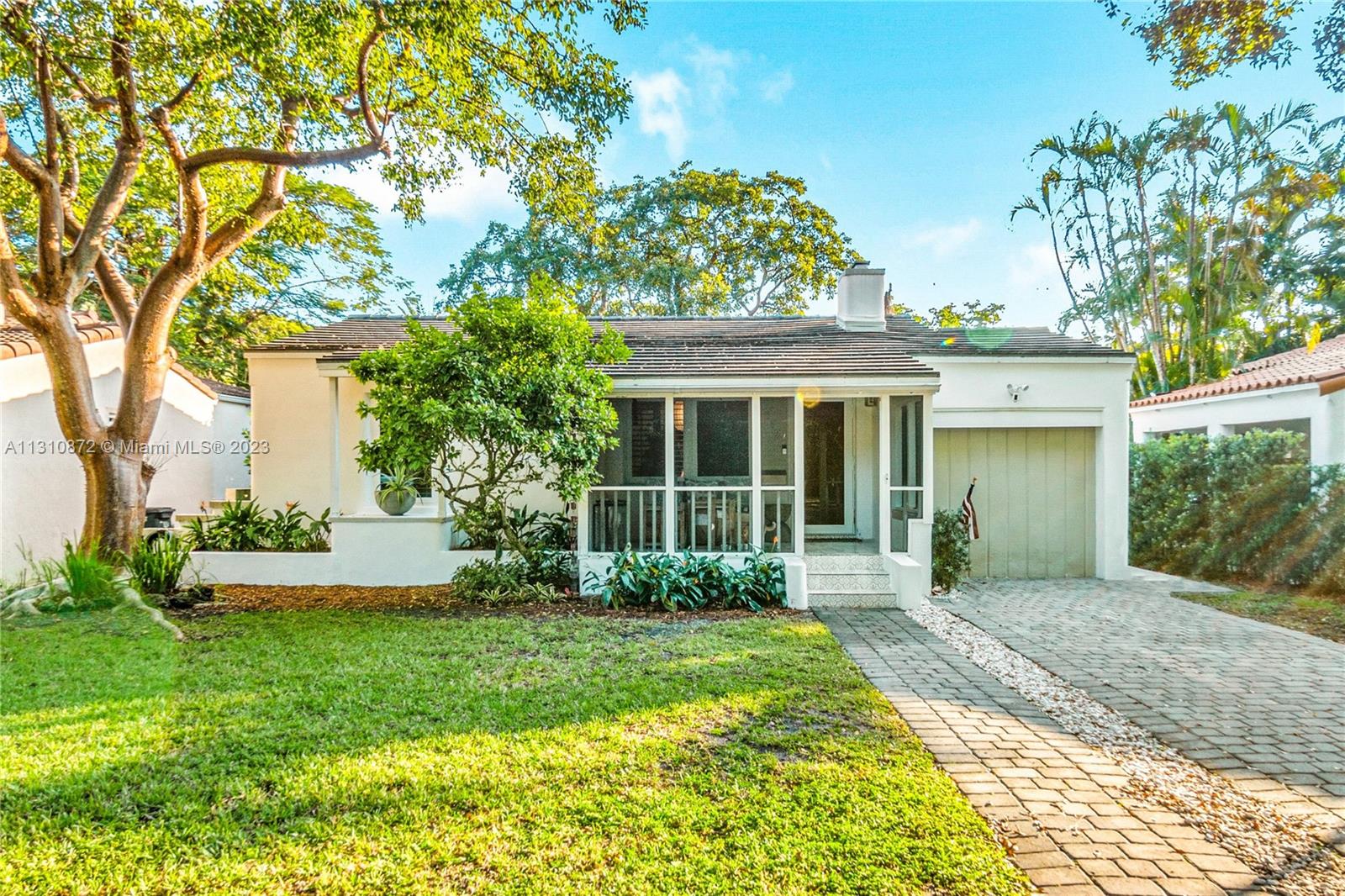 Fall in Love with this 1078sf 3/1 charming Coral Gables completely modernized Bungalow. Enchanting outdoor entertaining retreat in Lush tropical setting- elegant lighting, New Salt Water Essig pool, pergola, summer kitchen, fire pit. Brand new Kabinart Chef’s dream top of the line kitchen. Miele Appliances, quartz countertop, floating shelves. Impact windows, Plantation shutters, Hard Wood floors preserved under luxe Bella Citta in grained laminate. Separate entrance for 3rd bedroom/office and laundry room with porcelain wood tiles. Perfect location! Steps away from Downtown Coral Gables/Miracle Mile dining & shopping. Mins to Granada Golf Course, Venetian Pool, A+ schools. Working Fireplace. New California Closets, doors/hardware, Waterworks Bathroom, AC & Roof 2020 + many more upgrades.