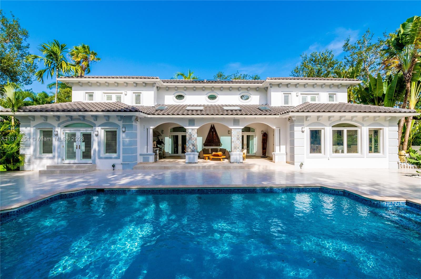 Mediterranean gem, ideally located on a private street, in the beautiful gated community of Palms Estates. Completely remodeled, this Pinecrest masterpiece has volume ceilings, venetian plaster & marble floors throughout. The Scavolini gourmet kitchen is an epicurean dream boasting Gaggeneau appliances and gas range. Upstairs enjoy 3 en suite bedrooms; 2 w private balconies. Luxurious ground floor primary suite w private sitting area/home office, 3 large walk-in closets & private access to pool and garden. Outside enjoy covered terraces, outdoor kitchen and heated pool; ideal for entertaining. Detached 2 car garage plus maid’s quarters, impact glass windows & full home generator complete this stunning. An absolute must see.