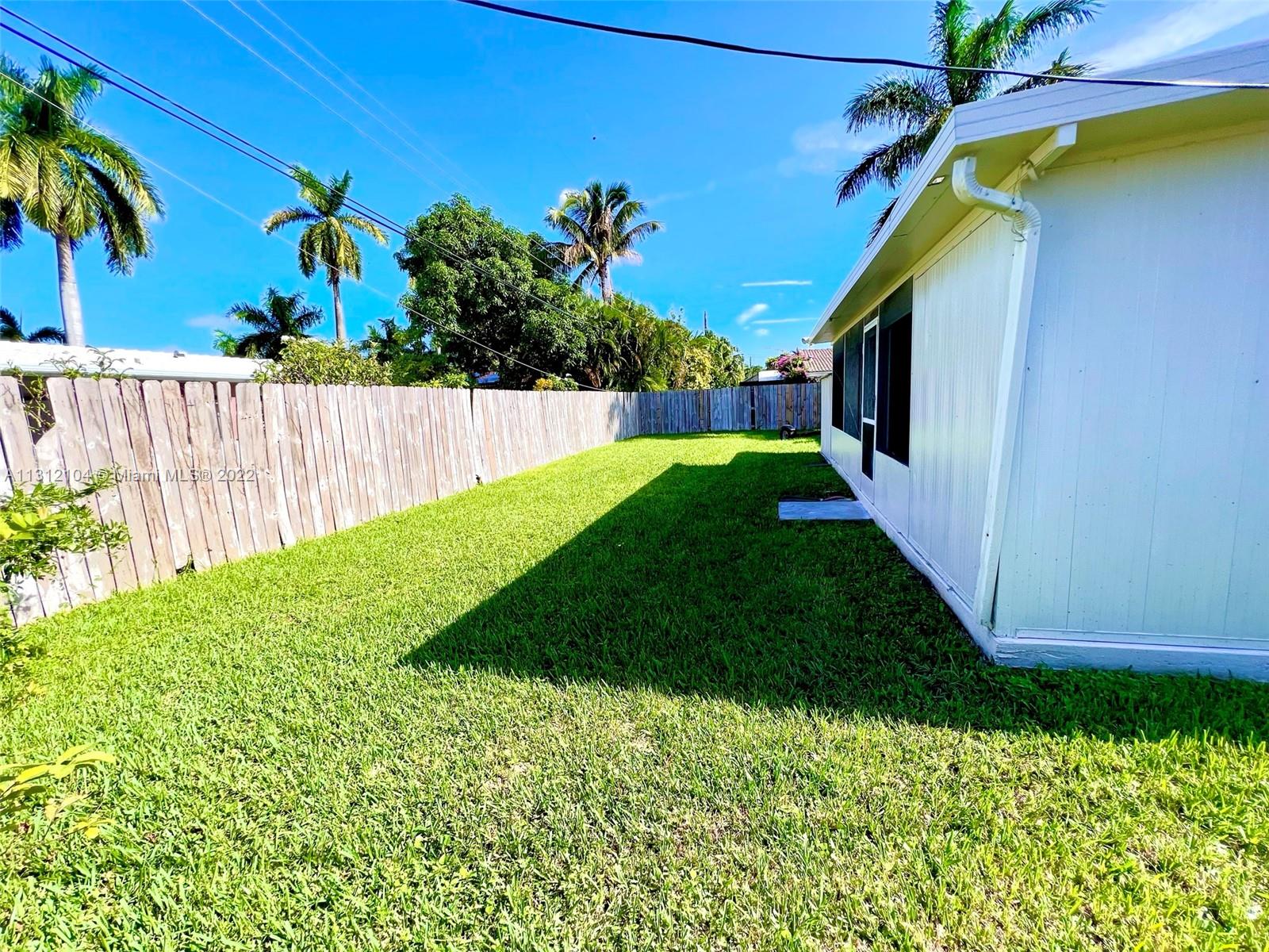 FENCED BACKYARD WITH PLANTY OF SPACE FOR A POOL