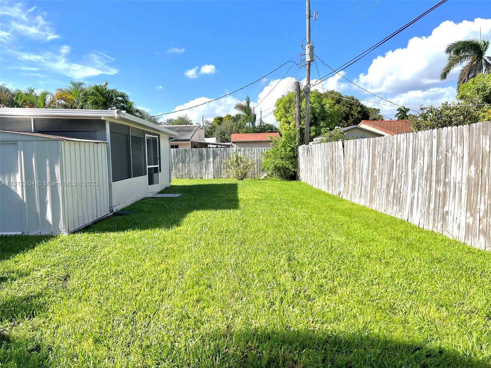 FENCED BACKYARD WITH PLANTY OF SPACE FOR A POOL