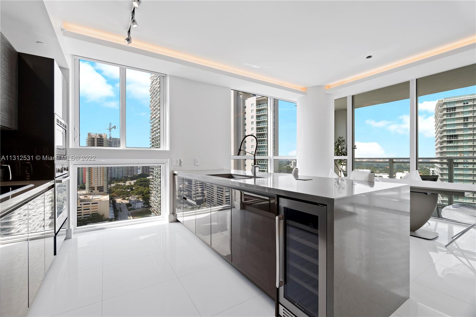 FULLY UPGRADED like new, barely used since 2016!! Two Bedroom/  Two Bath apartment available for sale at one of Brickell's finest condominiums, The Bond. This spacious and bright apartment features stunning porcelain tiles floors, custom recessed and soffit lighting, motorized rolling blinds, upgraded master bedroom and bathroom with TOTO Washlet toilet, home office with custom millwork, custom closet build outs, and more. Kitchens are finished with NOLTE cabinetry and PORCELANOSA fixtures. Spectacular city views from the expansive private balcony. The Bond offers unparalleled amenities including spa complete with steam room and sauna, private cabanas with outdoor kitchen and grill, state of the art gym, library, swimming pool, and hot tub.