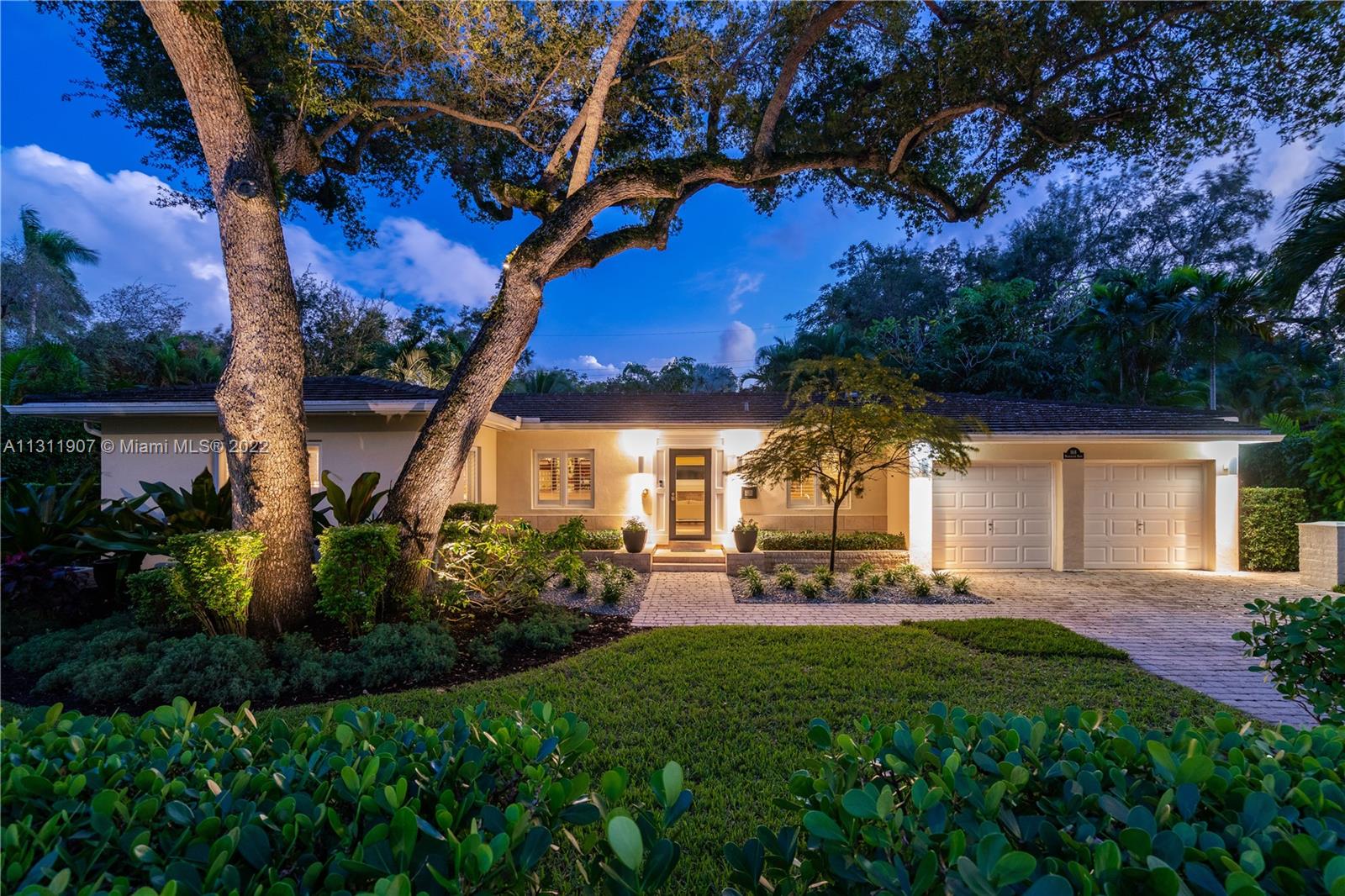 This idyllic Coral Gables home is a jewel. Quality, high-end finishes are evident throughout this 2000 sf home. Gorgeous wood floors and moldings enhance the vaulted ceilings and generously sized rooms. The beautiful great room is where you will want to spend all your time. An Italian-designer kitchen offers excellent storage as well as a gas stove, pot filler & wine cooler. The wood-burning fireplace, designer walk-in closets, & plantation shutters add additional charm and refinement. The bonus room is a perfect spot for a home office. A summer kitchen and BBQ and outdoor patio will be used year-round for entertaining.  This home is in a prestigious Coral Gables pocket, sitting high on the ridge in a no flood zone. Two car garage with lots of storage.  A Very Special Home.