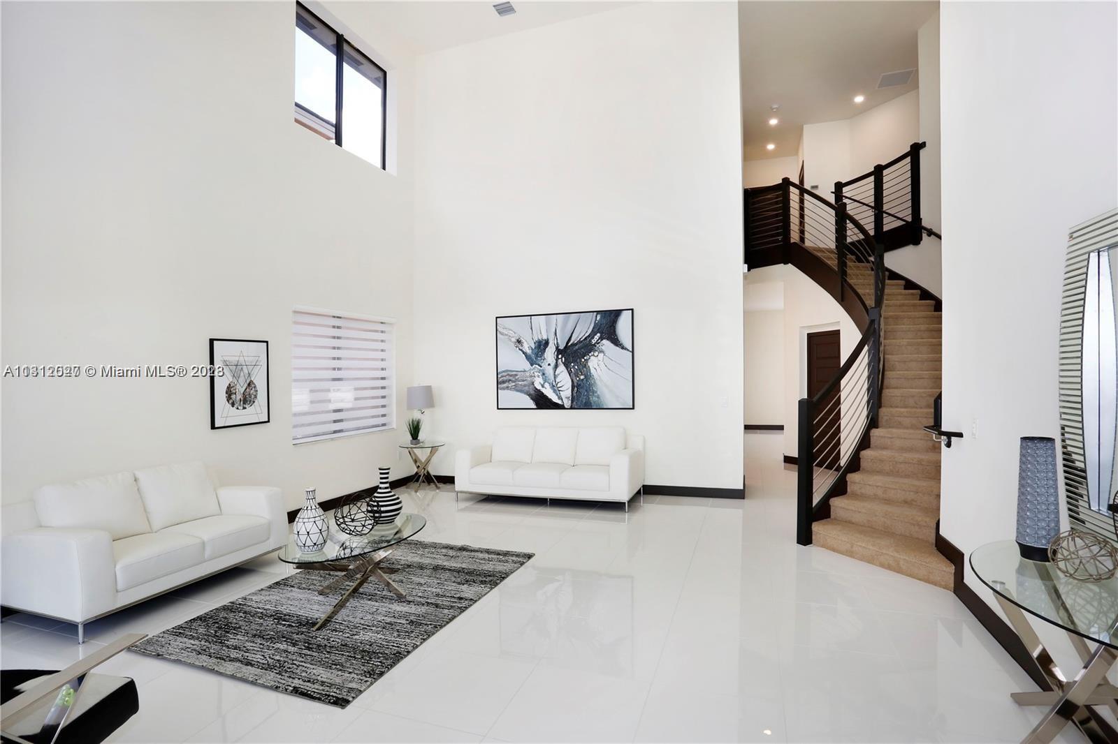 Foyer/living room previously staged