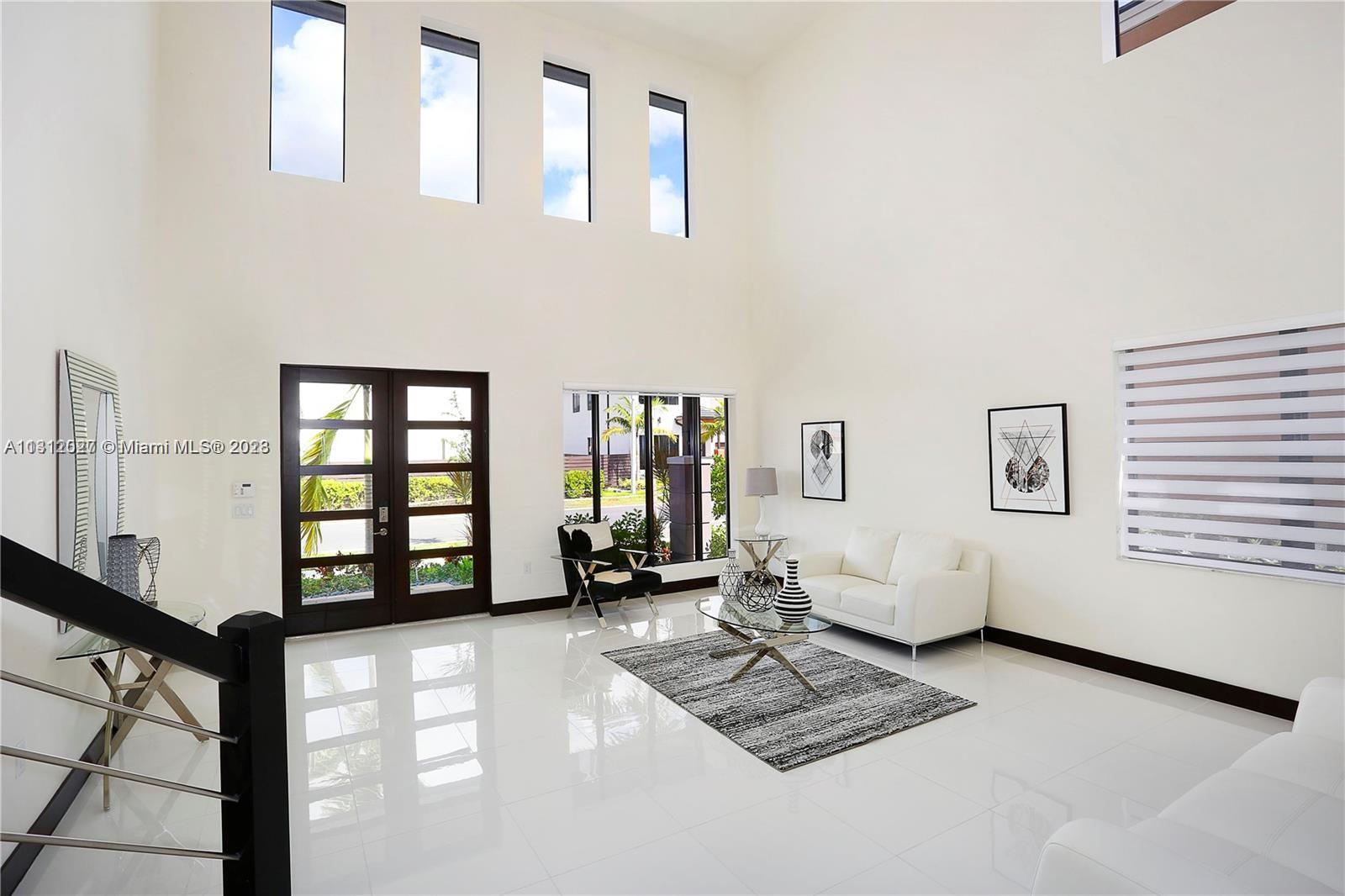 Foyer/living room previously staged