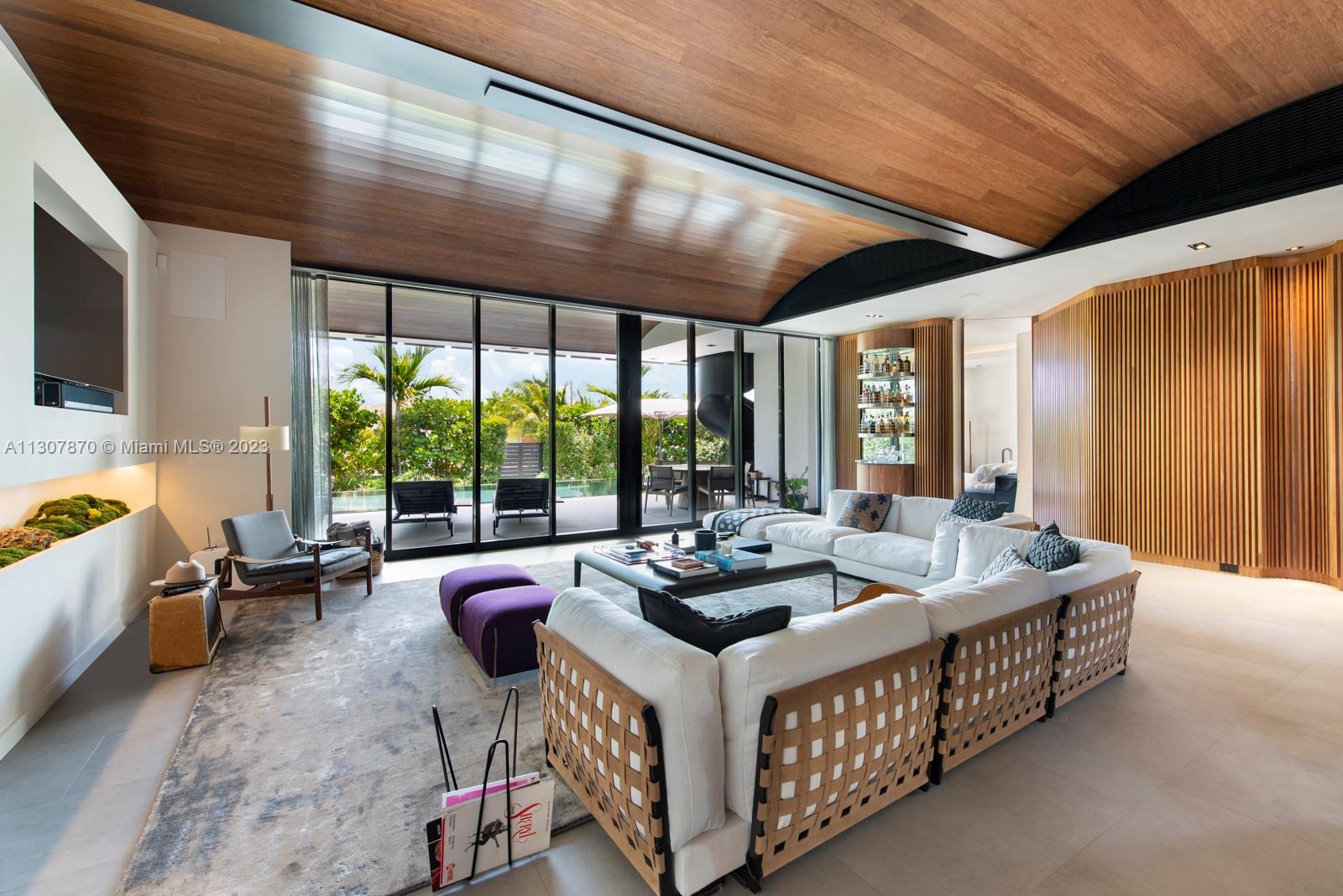 Built in 2018, this custom exquisite waterfront Villa is located in the prestigious 24H guard gated community Biscayne Pointe in Miami Beach. Open floor plan offers timeless luxurious living with interior features that embrace modern European style with Cumaru hardwood lined art walls and thoughtfully designed architecture for perfect acoustics in the entertainment areas. Bask in Miami’s natural tropical weather from the roof top sundeck offering 360 degree views and plunge pool or from the covered terrace overlooking the infinity pool with spa. Enjoy the convenience of 60 ft of waterfrontage with new dock, boat lift and no fixed bridges to Ocean Access. Additional features include full house generator, water filtration system, 1 car garage with A/C and 2 gated parking spaces.