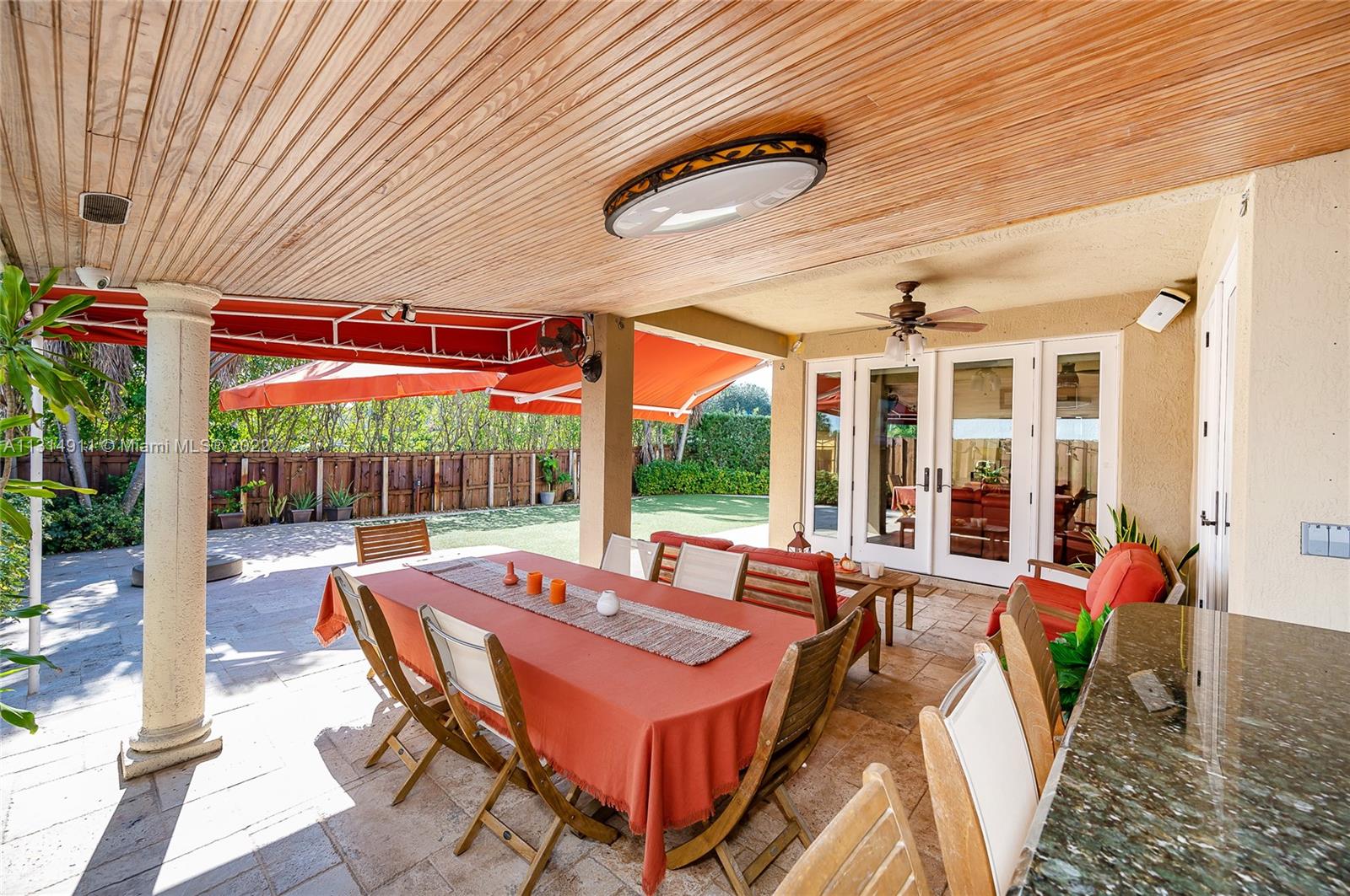 Very spacious entertaining area with patio, terrace,dining space, and summer kitchen
