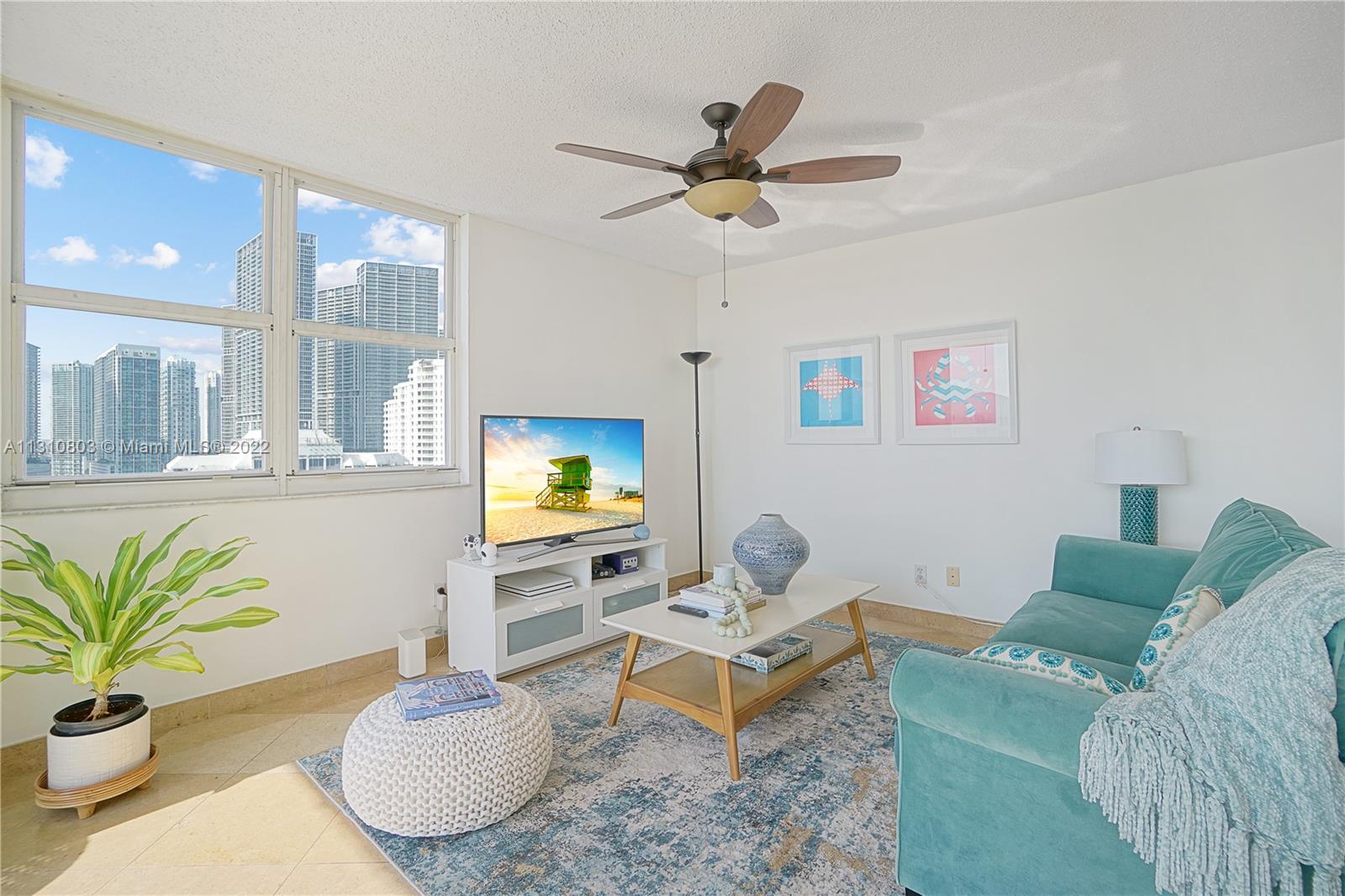 Living room  corner view with Brickell skyline