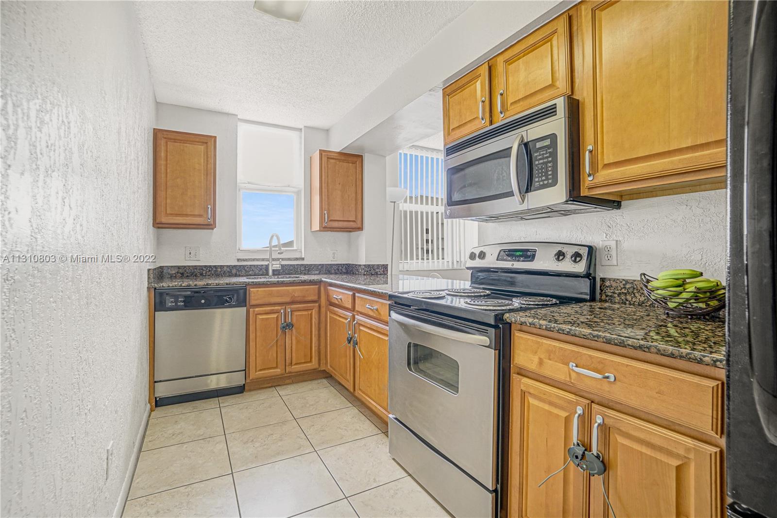 Kitchen with intracoastal water views opens up to dining room