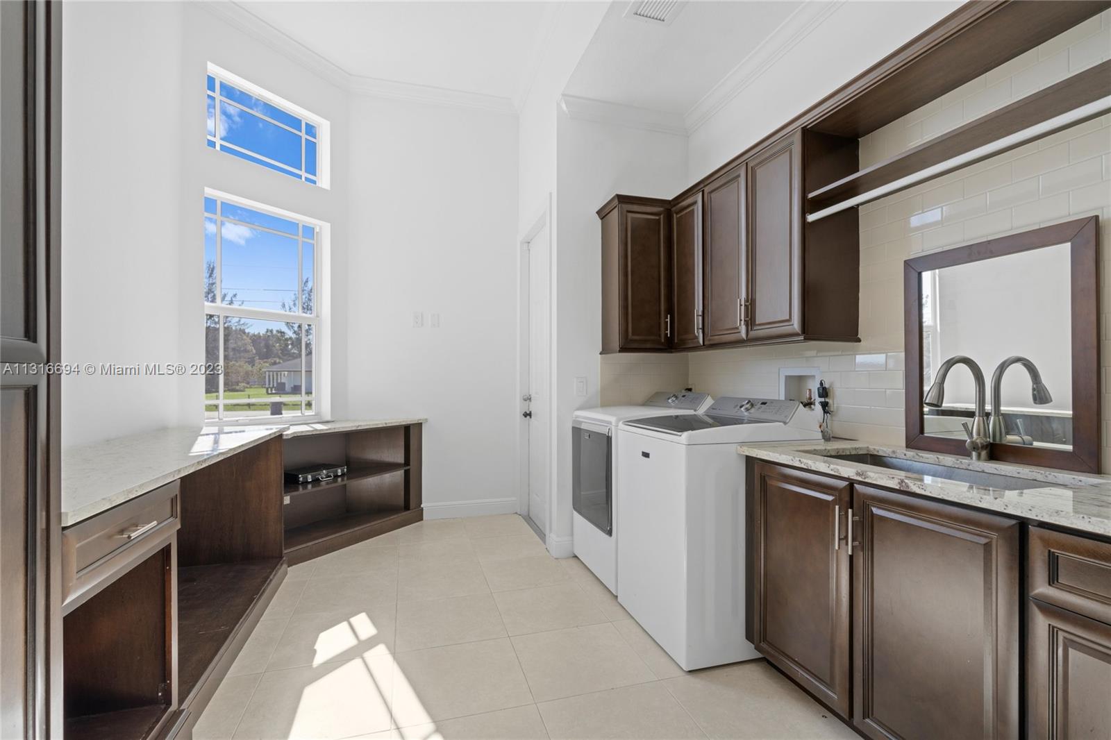 Conveniently access your oversized 2 car garage from the laundry room