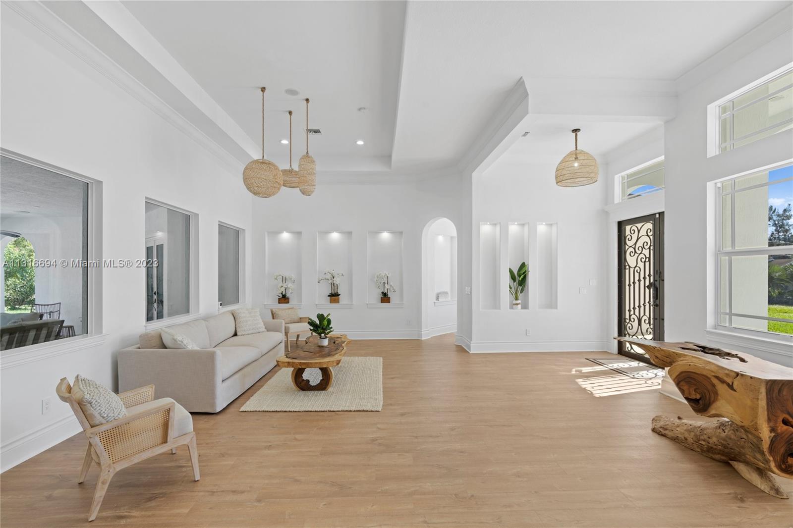 Soaring ceilings and gorgeous wood floors welcome you inside.
