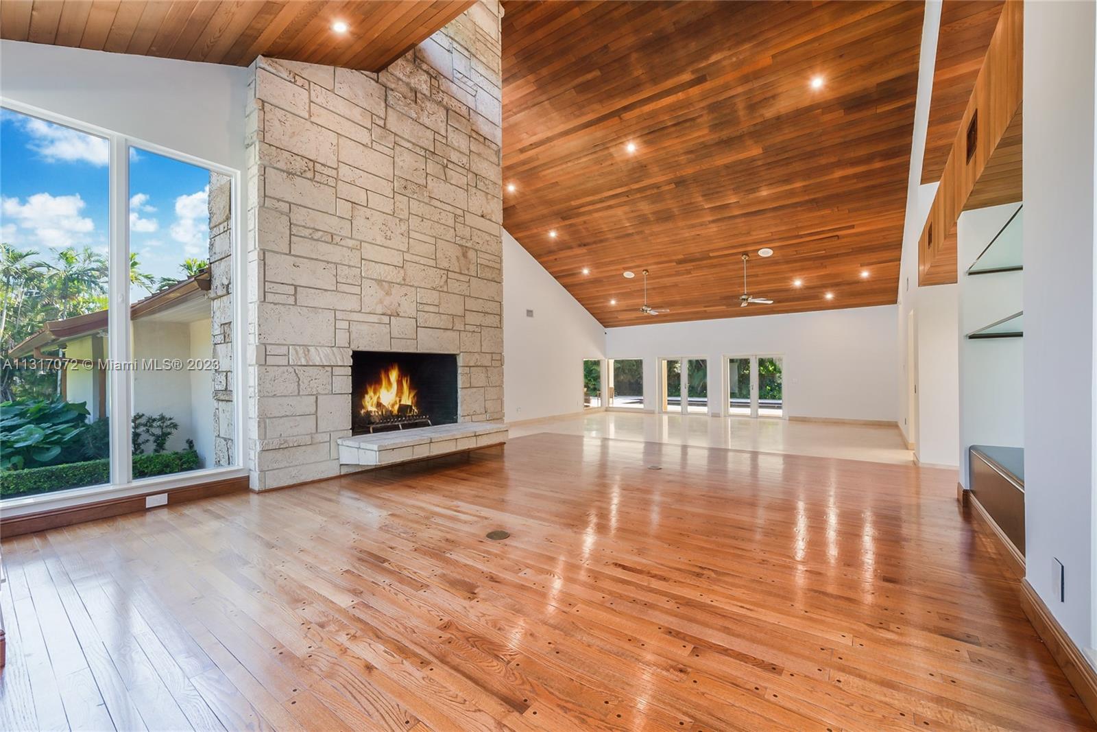 Pinecrest Grove- Gated Community of only 9 homes, all on 1 + acre lots- Award Winning Hollub Design - Huge 43,560 sf wide lot- many fruit trees,6 bedrooms 4 1/2 baths, 6734 sf under AC, Total 8073 sf . Impact windows + doors, metal roof, back up generator, 2 garages ( 2 car+ 3 car ) Total 5 car garage. 2 master suites,fitness room or home theatre, Indoor Laundry, Huge Formal Dining room,Impressive High Wood beam Living room with tall coral rock stone fireplace. Covered outdoor terraces with outdoor kitchen, lots of covered outdoor covered seating around the pool, Lush landscaping, circular driveway, very private back yard. This is a unique home in a very desireable pineccrest gated communit. House is Immaculate and ready to move in.