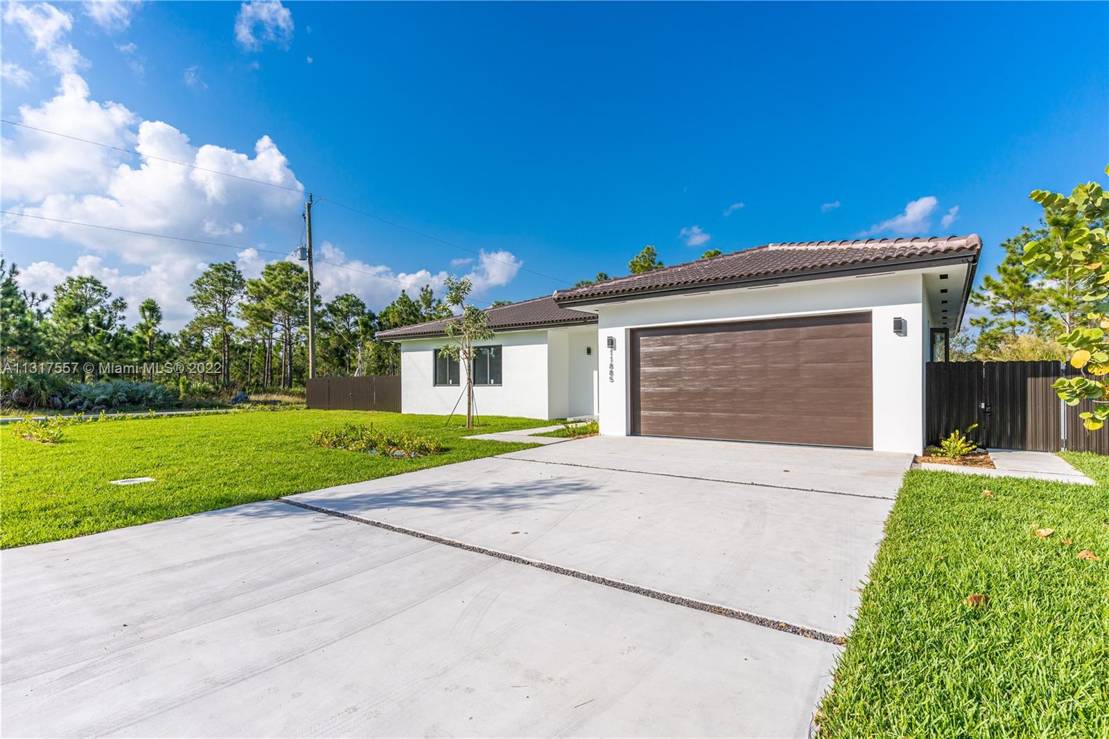 Beautifully Designed New Construction Home with 4 Bedroom 3 Baths 2 CG on a 1/4 Acre Lot. It features high ceilings, Stainless Steel appliances, waterproof laminate flooring, Laundry Room, modern designed bathrooms, impact windows and doors. Spacious kitchen opens to an entertaining area and covered terrace. The backyard is completely fenced with a metal private fence and is equiped with a state of the art septic tank and well with water treatment and softining equipment. No detail was spared. Beautiful landscaping throughout. Situated in a quiet family neighborhood close to shopping centers and major highways. Property is situated next to a state reserve which provides additional privacy. Seller will contribute Buyer 1% towards closing costs.