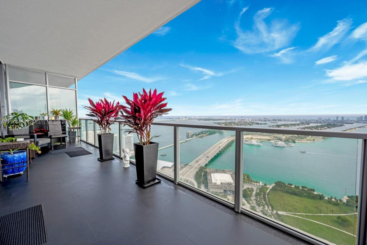 VIEWS, VIEWS AND VIEWS FROM THIS UNIQUE SOUTH CORNER RESIDENCE AT MARQUIS. ENTER THE FOYER THROUGH A PRIVATE ELEVATOR AND ENJOY EXPANSIVE VIEWS OF BISCAYNE BAY, MIAMI BEACH AND MIAMI SKYLINE FROM ITS BRIGHT AND OPEN DOUBLE WIDE LIVING ROOM WITH FLOOR TO CEILING GLASS WINDOWS. PROFESSIONALLY REMODELED, THIS RESIDENCE HAS BEEN CONVERTED INTO A 1 BEDROOM MASTER SUITE THAT CONNECTS TO A SECOND ROOM PERFECT FOR A HOME OFFICE, GYM OR LOUNGE. CUSTOM KITCHEN HAS VIKING APPLIANCES, CREAM LEATHER WALLPAPERS, BLACK MARBLE FLOORS AND BACKSPLASH, WITH WALK IN PANTRY. MARQUIS OFFERS THE ULTIMATE LIFESTYLE WITH UNPARALLELED ACCESS TO THE DESIGN DISTRICT, THE ADRIENNE ARSHT CENTER, MUSEUM PARK, THE AA ARENA, JOE'S STONE CRAB, MIAMI AIRLINE TERMINALS, AND METRO MOVER STATIONS.