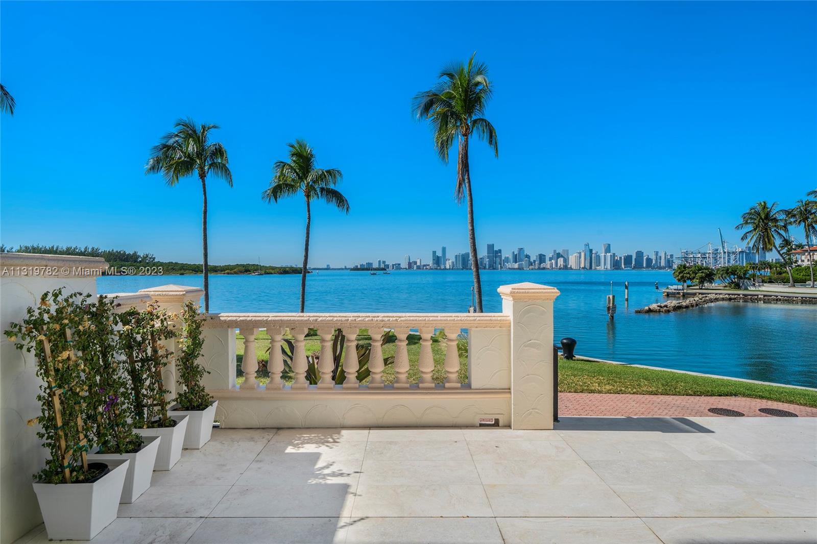 This most sought-after ground floor 3BR/3+1BA corner unit sits on the point of Fisher Island providing panoramic unobstructed views of Virginia Key, Biscayne Bay, Fisher Island Marina & sunsets over the downtown Miami Skyline. This French modern unit has been totally remodeled in 2022 & boasts French oak hardwood floors, 3,317 SF with open living & dining areas surrounded by walls of glass w/direct bay/city views & access to a full wrapping terrace. A Chef’s kitchen sports La Corneu cooktop, top-of-the-line Gaggenau & Miele appliances & crystal agate center island w/eat-in seating. The sumptuous principal suite features a seating area, large walk-in closet & stunning principal bathroom w/dolomite floors & walk-in rain shower. The 2 other bedrooms each uniquely designed w/en-suite baths.