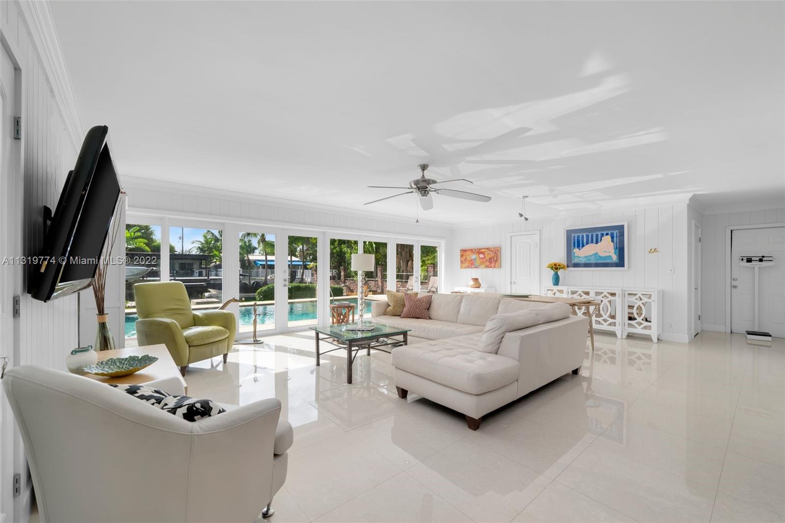 A perfect family home in one of the most family-friendly neighborhoods in Miami Beach, Biscayne Point. This beautiful Mid-Century home is bright and open with great views of the pool and canal waterway as you enter. A formal living room, family room and dining room provide ample space for daily living and entertaining. Porcelain tile floors throughout the main living areas. Impact windows & doors, cabana bath, spacious carport, covered backyard patio and 60 ft. of waterfront with room for a boat lift. This beautiful and tranquil island community has 24 hour guard-gated security and is located just blocks from the beach.