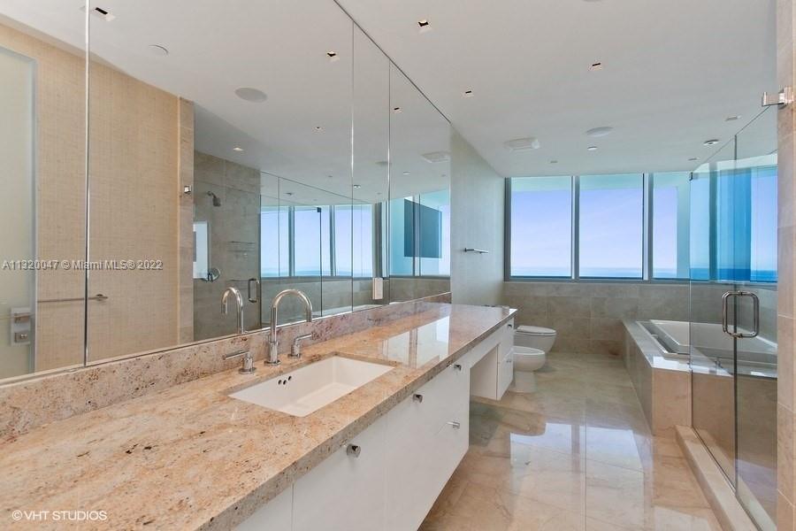 1 of 2 Master Bathrooms with built-in TV in the mirror