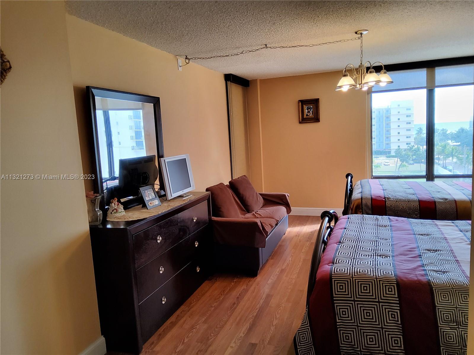 Master bedroom facing door to balcony