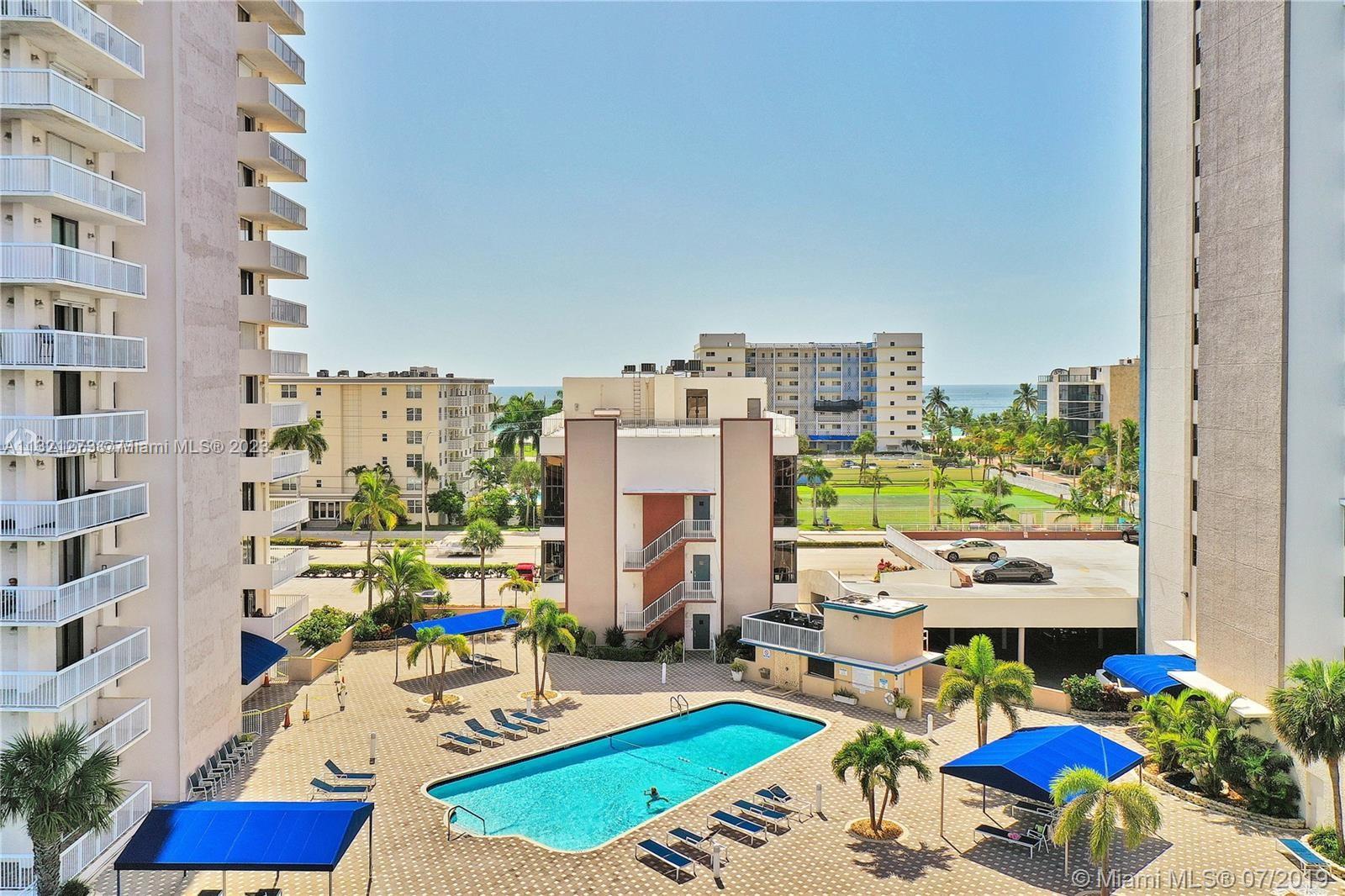 Picture of pool showing both buildings
