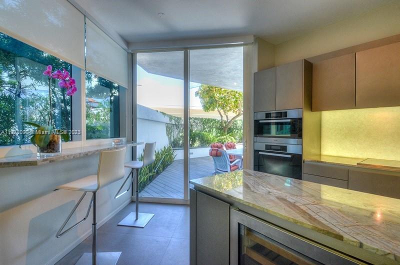 Kitchen with breakfast area and access to terrace