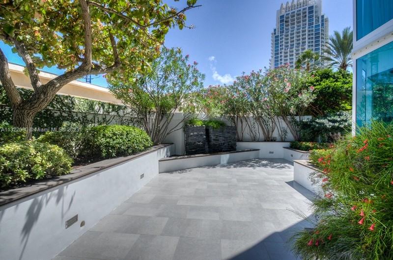 Terrace with planters and waterfall