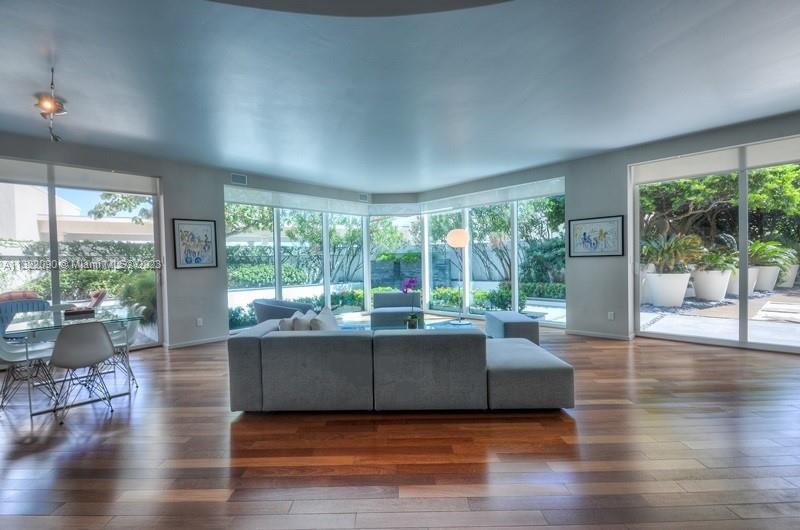 Living room surrounded with floor to ceiling windows