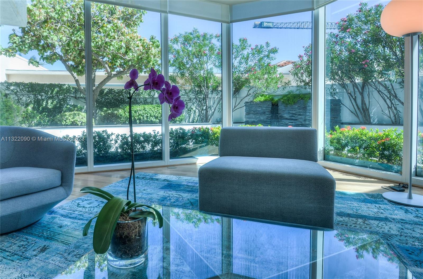 Living room with tropical landscaping