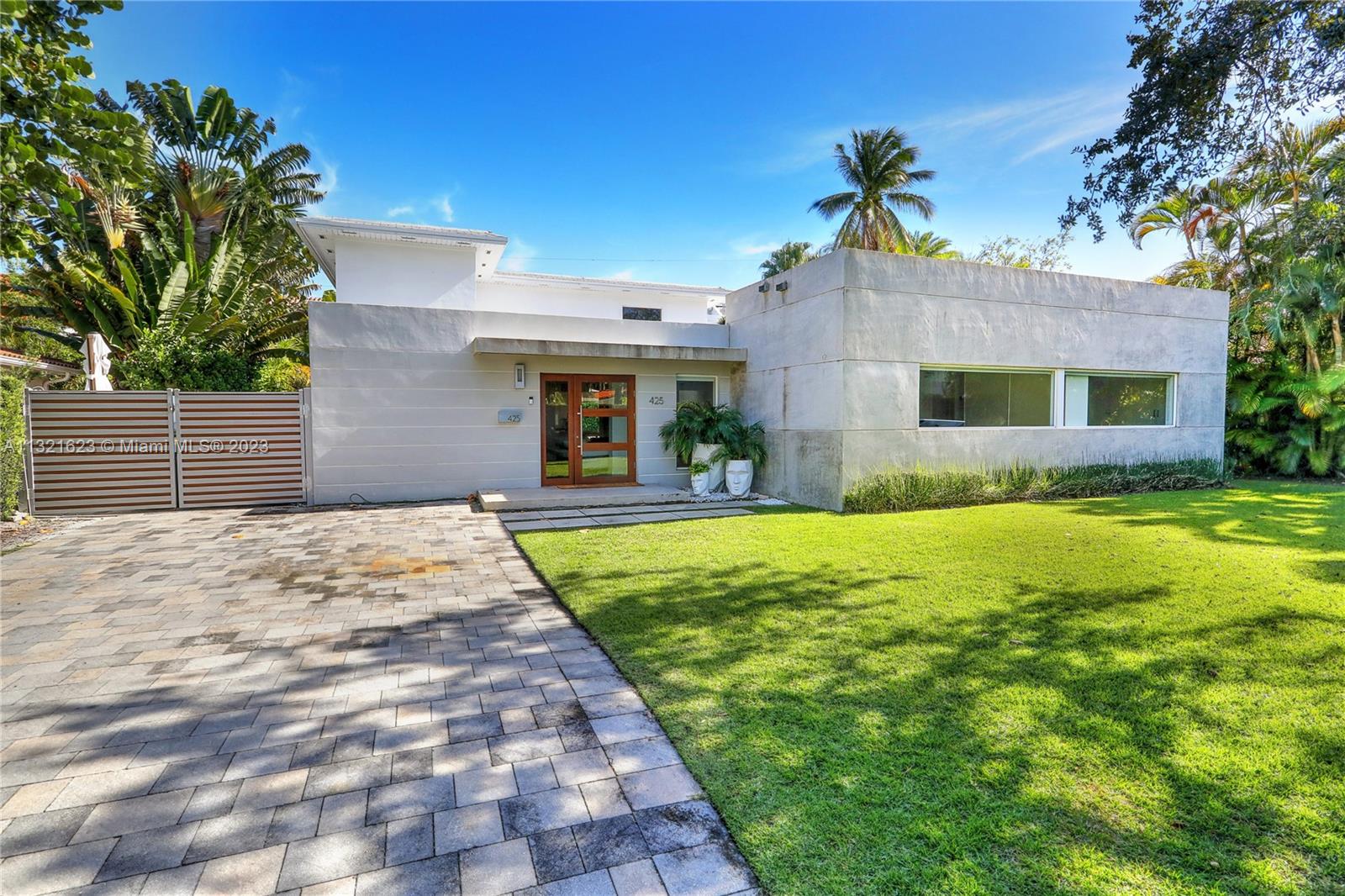 Beautifully redesigned modern pool home in the heart of Key Biscayne located on a quiet street within walking distance to Village Green Park and Key Biscayne Elementary School. Home features a bright open floor plan with 5 bedrooms 4 baths, a luxurious kitchen with quartz counter tops, wood cabinets and top-of-the-line appliances, large living room and dining area overlooking the outdoor living space that highlights the best of Miami’s lifestyle with its impressive pool, electric roof pergola and outside summer kitchen!  Additional features include impact windows and doors, wood like tiles throughout, new air conditioners, water heaters, electric panel, water meter and driveway.